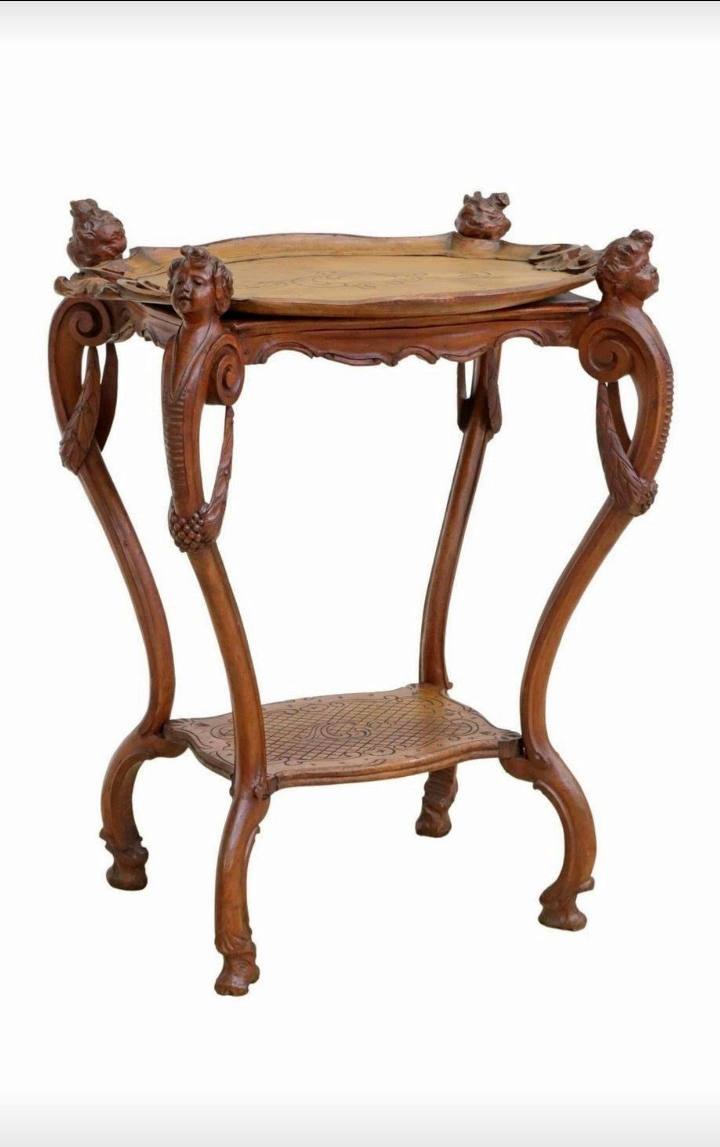 A lovely French Louis XV style hand carved oak two-tier tea / dessert server table with beautifully aged warm patina. circa 1900

Born in France at the turn of the late 19th / early 20th century, exceptionally executed in sophisticated Louis 15th