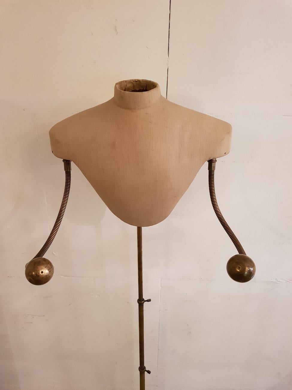 Old French unique mannequin model from the late 19th-early 20th century with adjustable arms and hands, standing on a cast iron base with extendable brass frame.

The measurements are,
Depth 18 cm/ 7 inch.
Width 50 cm/ 19.6 inch.
Height max.