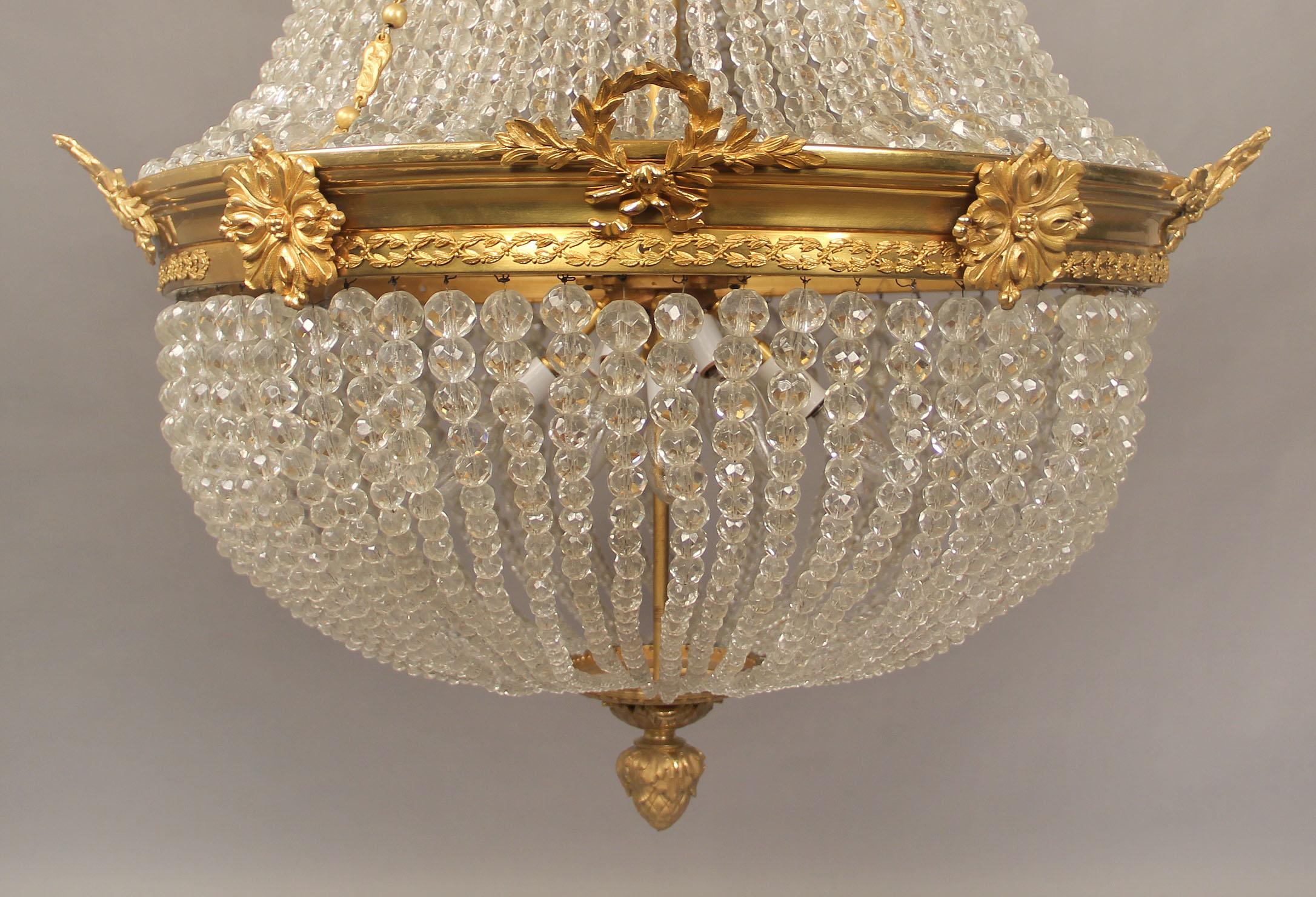 Late 19th/Early 20th Century Gilt Bronze and Beaded Twenty Light Chandelier In Good Condition For Sale In New York, NY