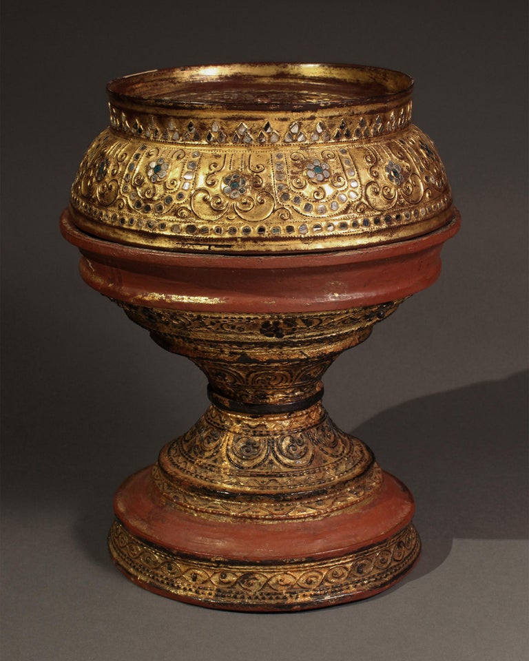 Late 19th-early 20th century lacquer standing offering dish, Burma

Beautifully lacquered in gold and red pigments, such offering dishes were designed to serve meals for monks, high officials and wealthy individuals.
  