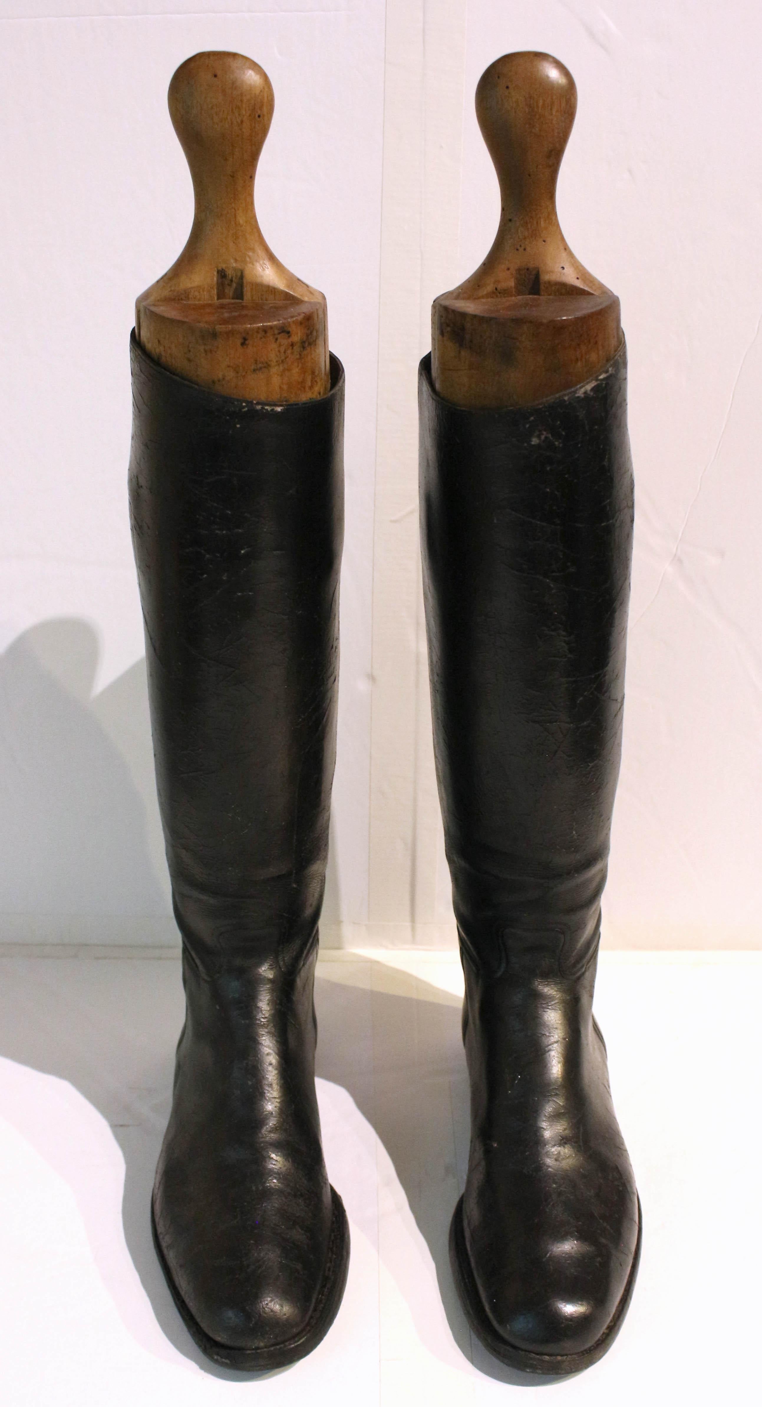 Late 19th to early 20th century leather pair of riding boots, English. With original turned wood trees or lasts. Rich black leather. Great fun & decoration!
24.75