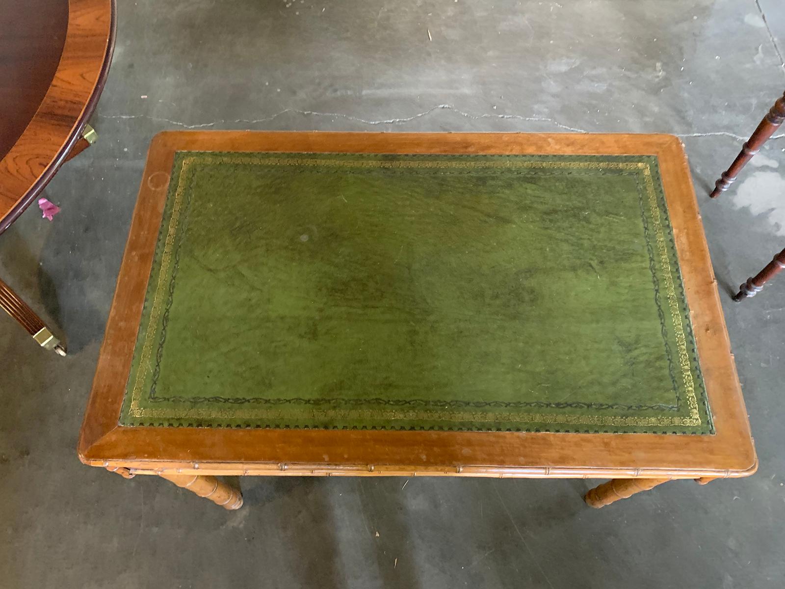 Late 19th-early 20th century English Regency style turned bamboo, green leather top desk with key
39.5