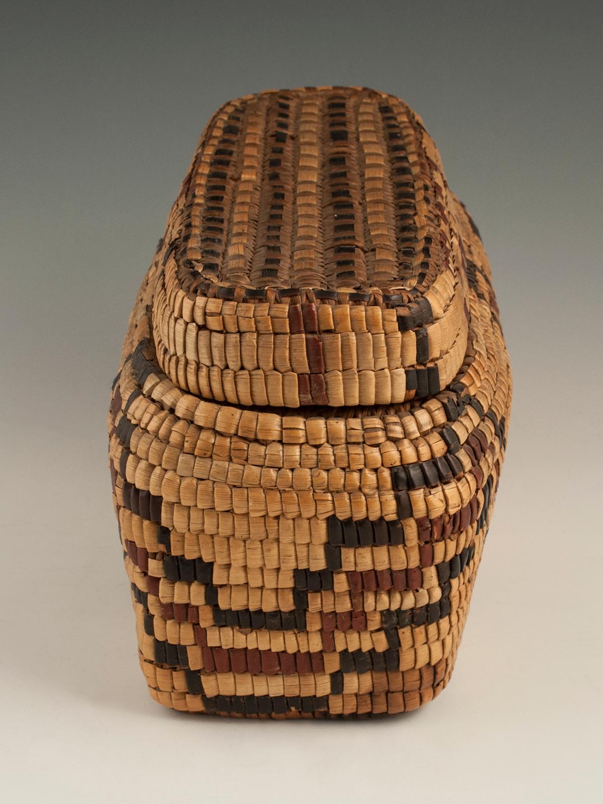 Late 19th-early 20th century tribal Native American Columbia river basket.

A graphic, fully imbricated polychrome reed and cedar bark lidded basket, unique to the Native American tribes of the Columbia River Plateau in the Pacific Northwest.