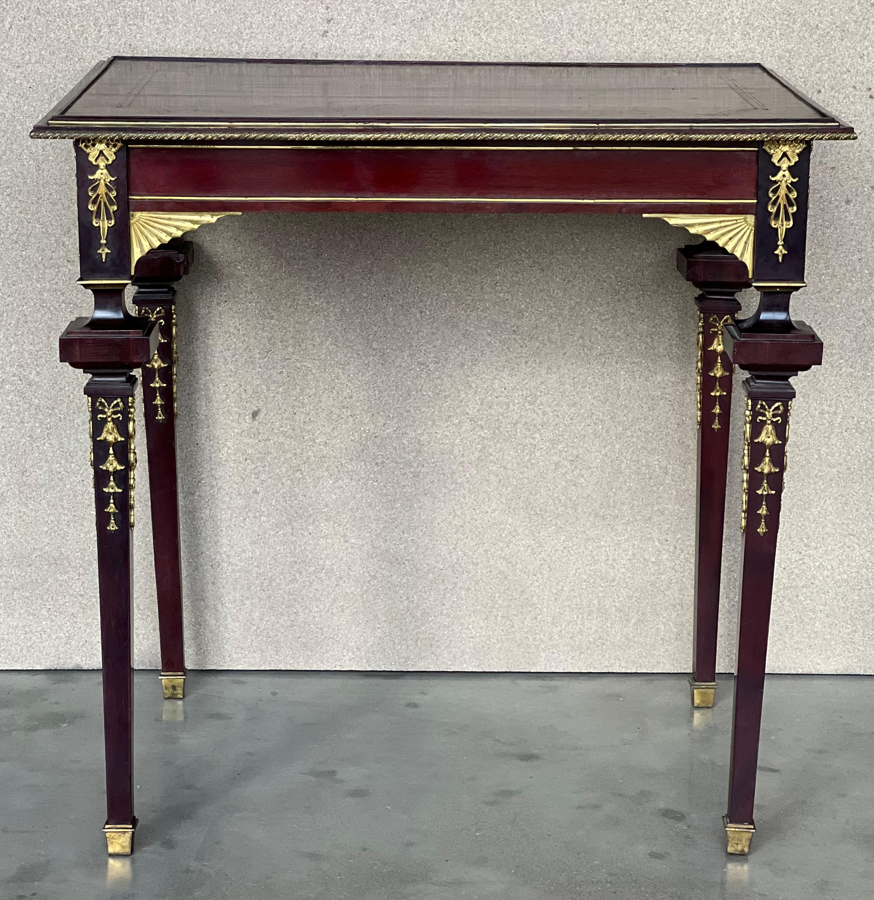 A very fine French 19th-20th century Louis XVI style mahogany and gilt bronze (Ormolu) mounted guéridon side table in style to François Linke, (1855-1946). The beleveled top has a fine inlay, the apron with finely chased cast ormolu mounts in