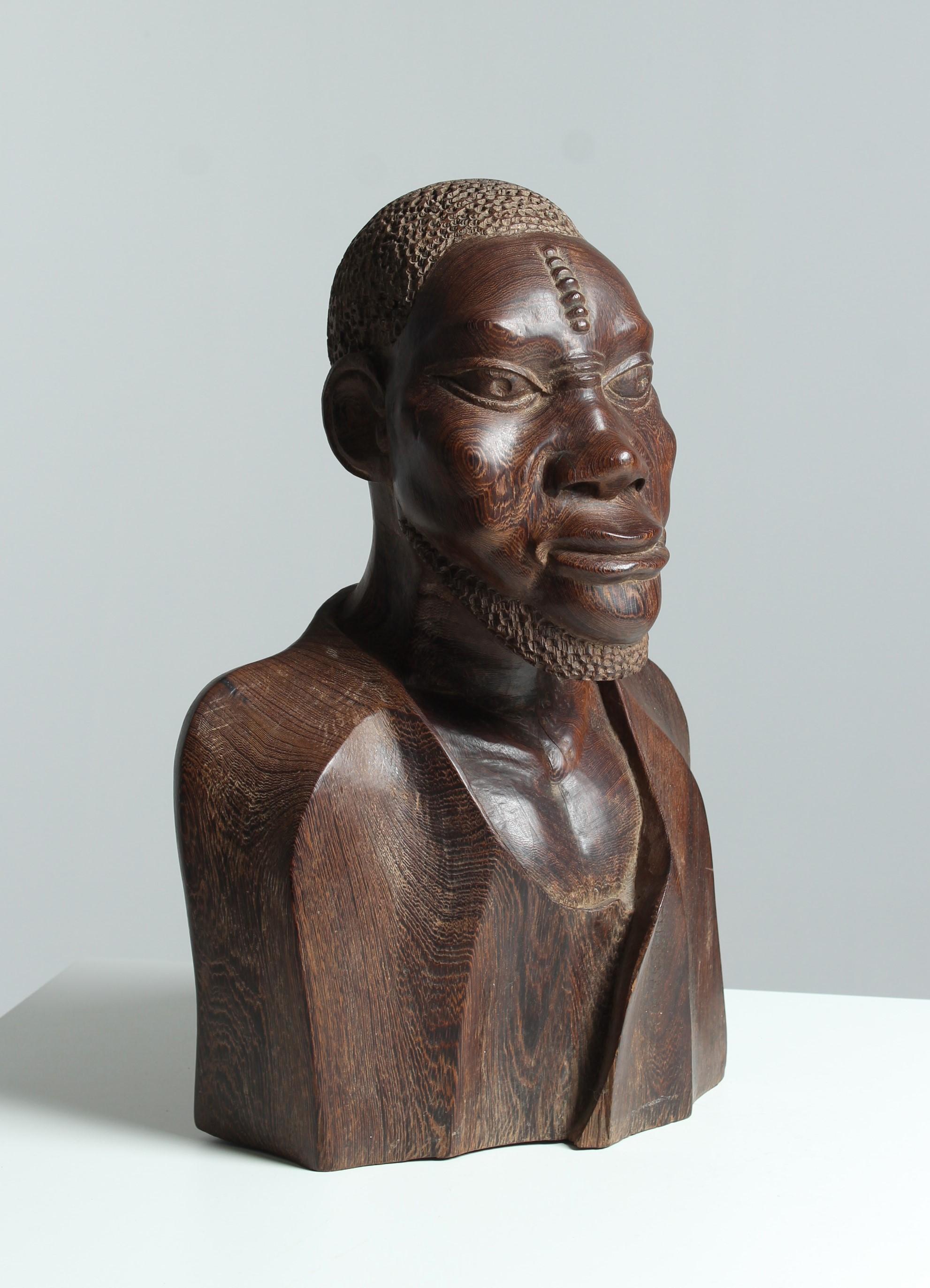 Exceptionally beautiful bust carved in the finest quality craftsmanship. Used is an extremely heavy and extremely hard wood. 

Presumably, the sculpture comes from the time when it came to an end with the French colonies. 
The figure is of an