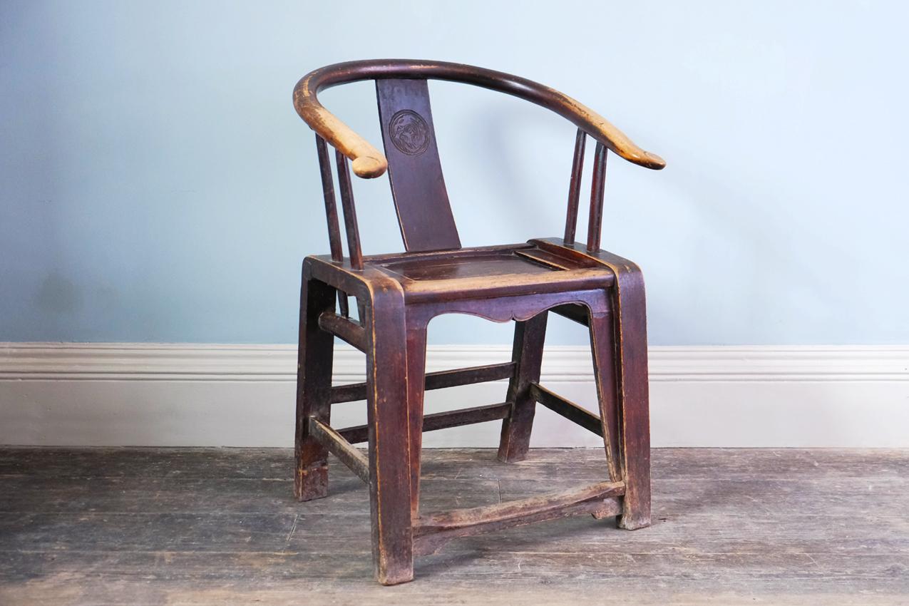 Chinese horseshoe armchair, 19th or early 20th century in elm. 


Dimensions: H89 x W55.5 x D47.5 cm
