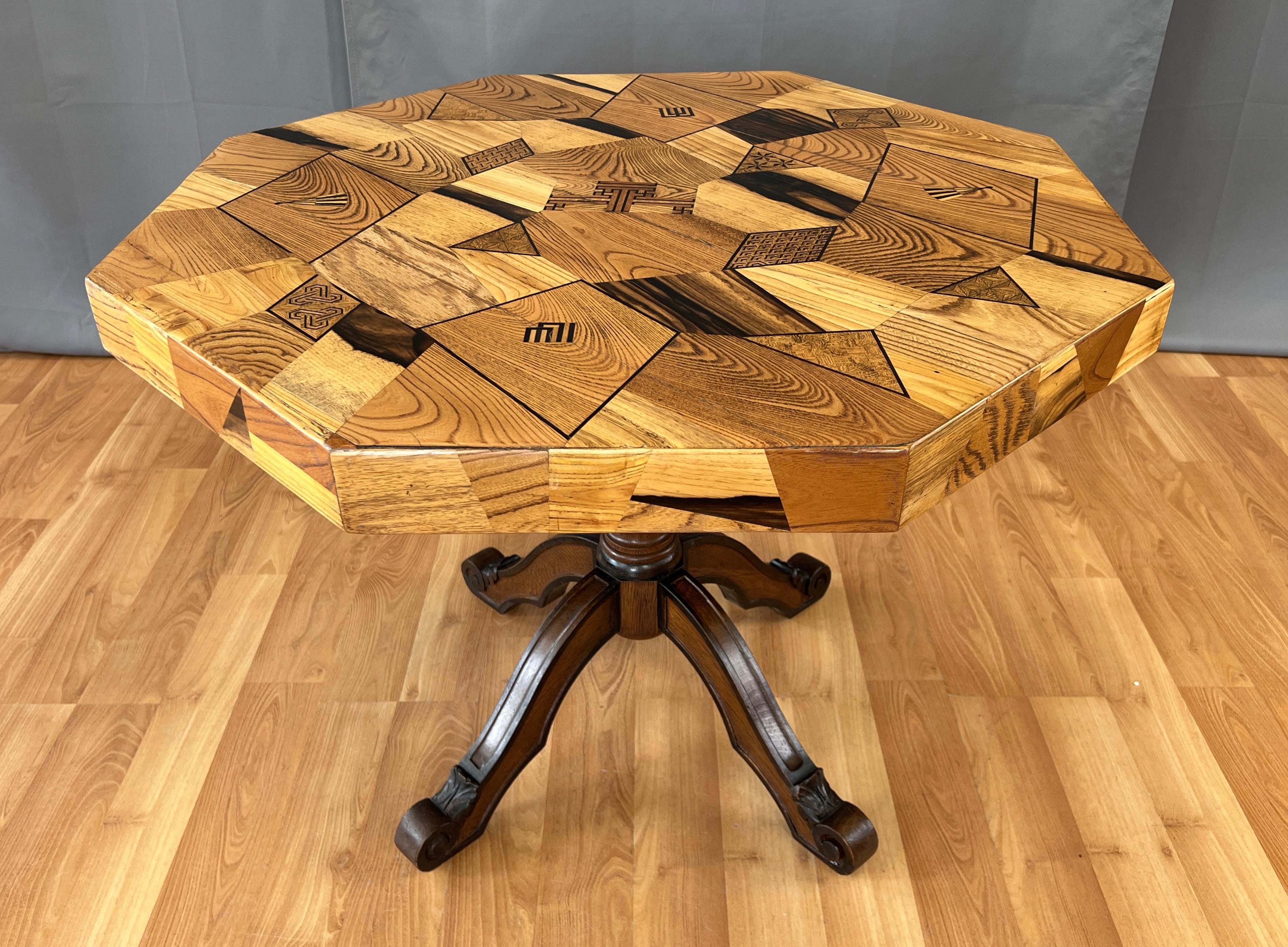 Offered here is a late 19th or early 20th century Japanese marquetry table, with a hexagonal shape top.
Variety of woods was used, and fine detailed craftsmanship to make this table. 
Different patterns, designs and symbols, makes a wonderful