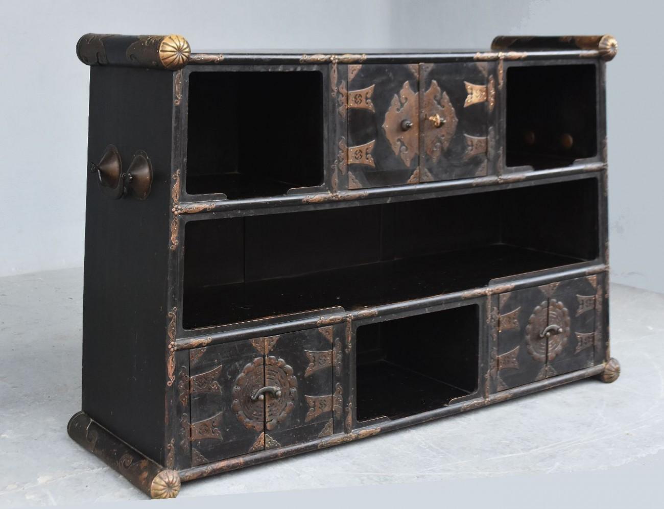 Original blackened wood trunk Korea time late 19th century brass decor richly decorated Svastika decor.