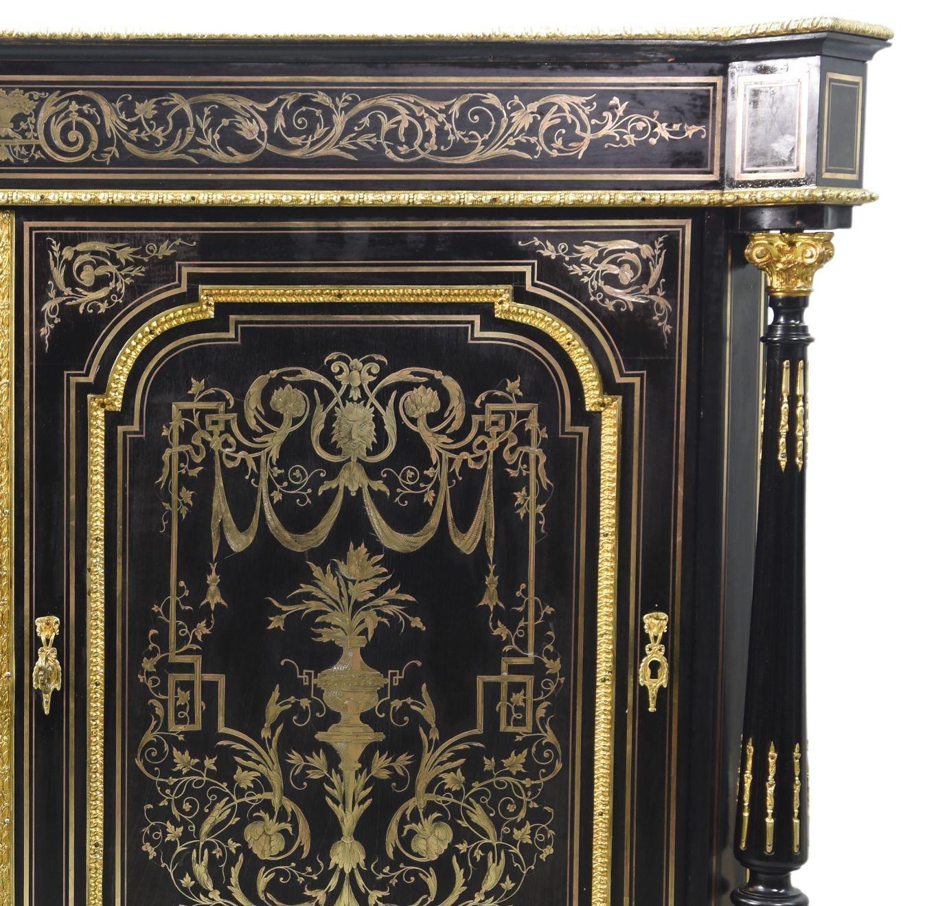 Sideboard with doors richly decorated with Boulle marquetry from the late 19th century on a blackened wooden background decorated with gilded bronze elements. White marble top. Dimensions 111 cm high by 139 cm wide and 49 cm deep. note that some
