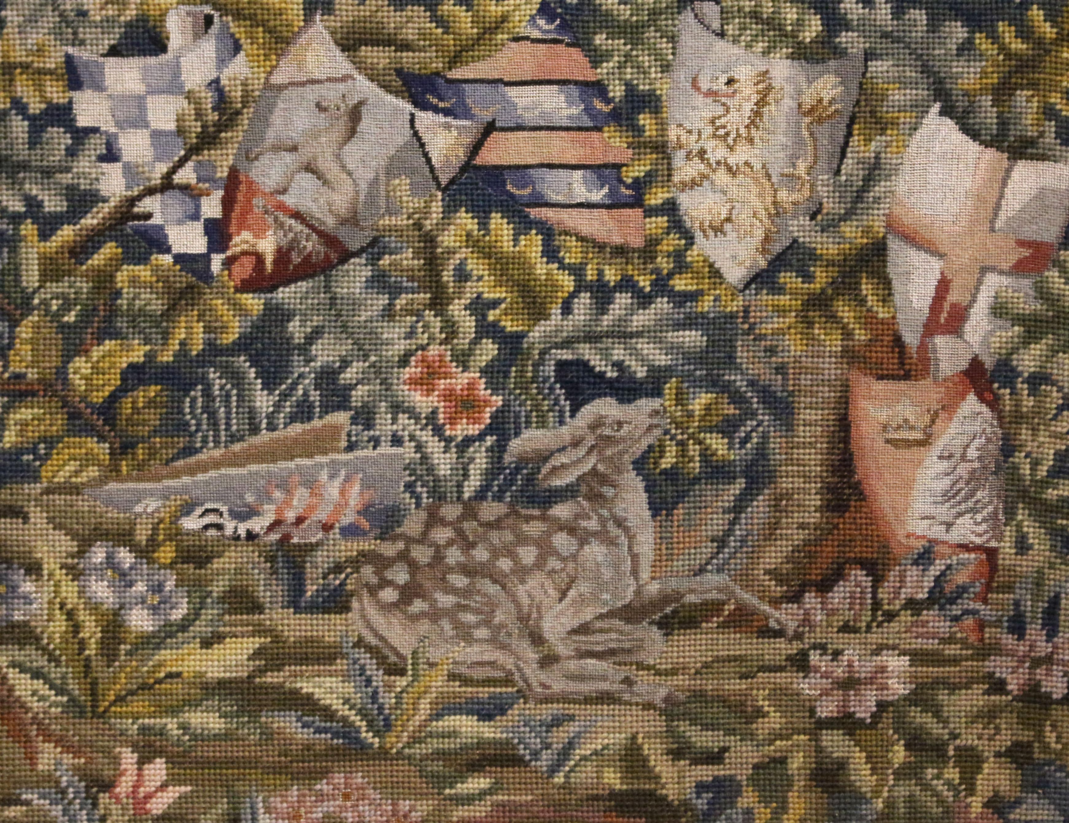 Needlepoint & pettipoint featuring shields & a deer, origin unknown. Likely a late 19th to 20th century decorative hobbiest piece. Good colors; molded gilt frame. Sight: 19.25