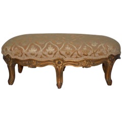 Late 19th-Early 20th Century Carved and Gilded French Walnut Foot Stool