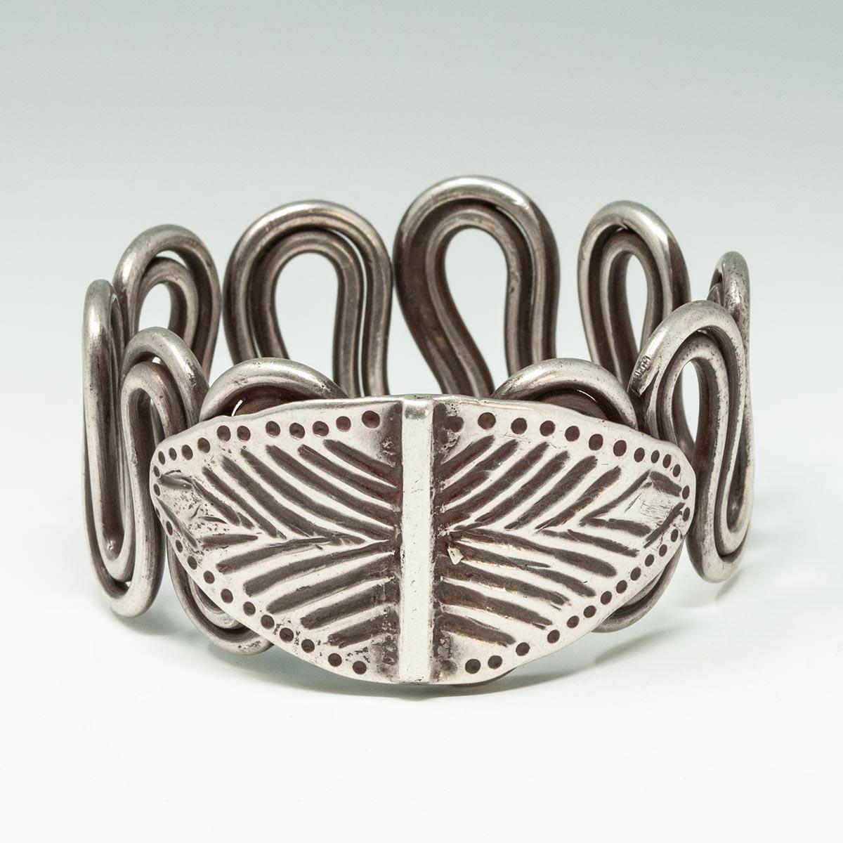 Late 19th to Early 20th Century Silver Wire Serpent Armlet, Rajasthan, India

A substantial silver cuff made of wire bent in the shape of a serpent, these bracelets were worn on the upper arm by women in Rajasthan. 
1.5 inches (3.8 cm) high, inner
