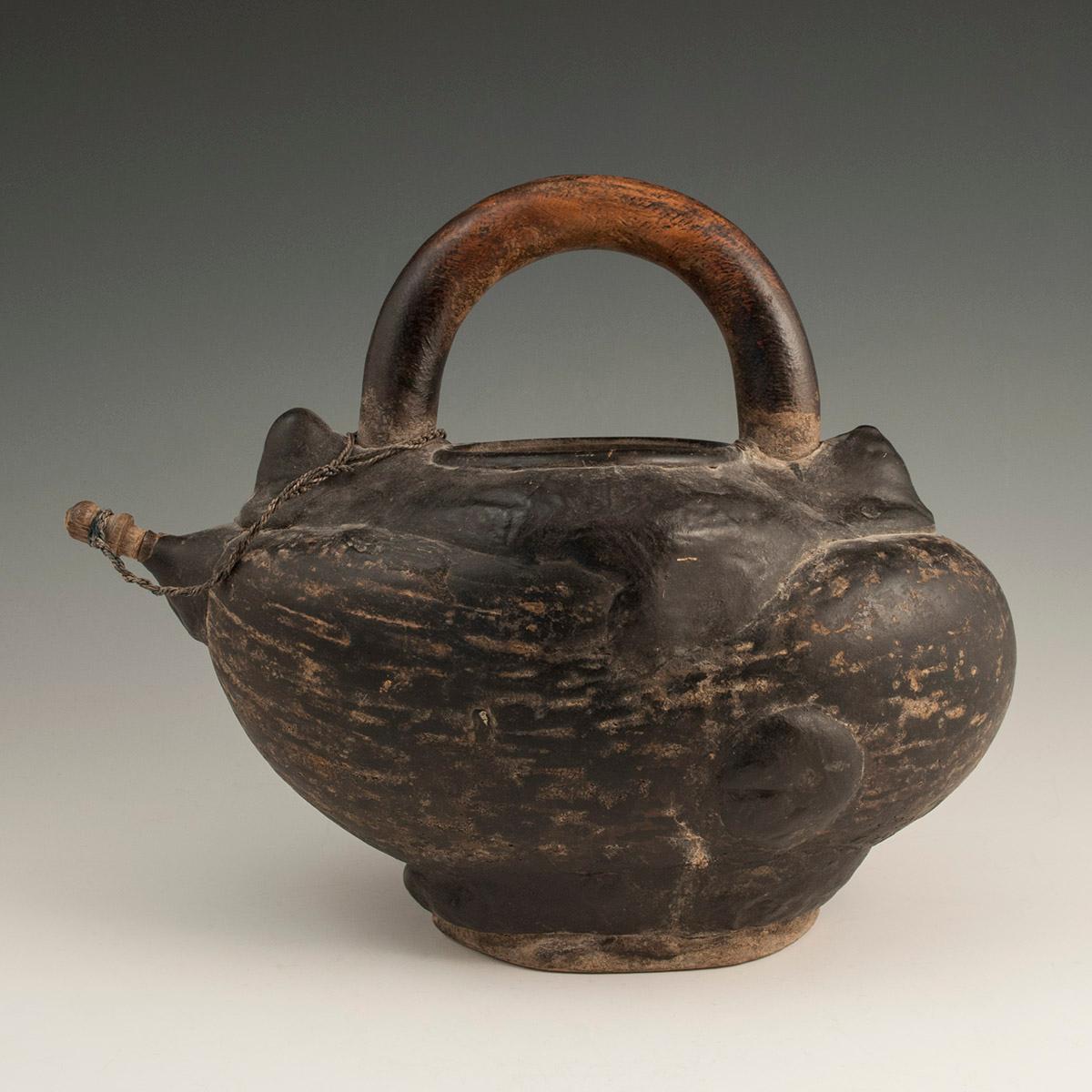 Late 19th-early 20th century tribal sadhu's Coco de Mer Kashkul, India.

A classic, well-worn coco de mer kashkul for carrying water, used by sadhus in India. This one has a wooden handle, spout and blobs of resin for water tightness. It lists a bit