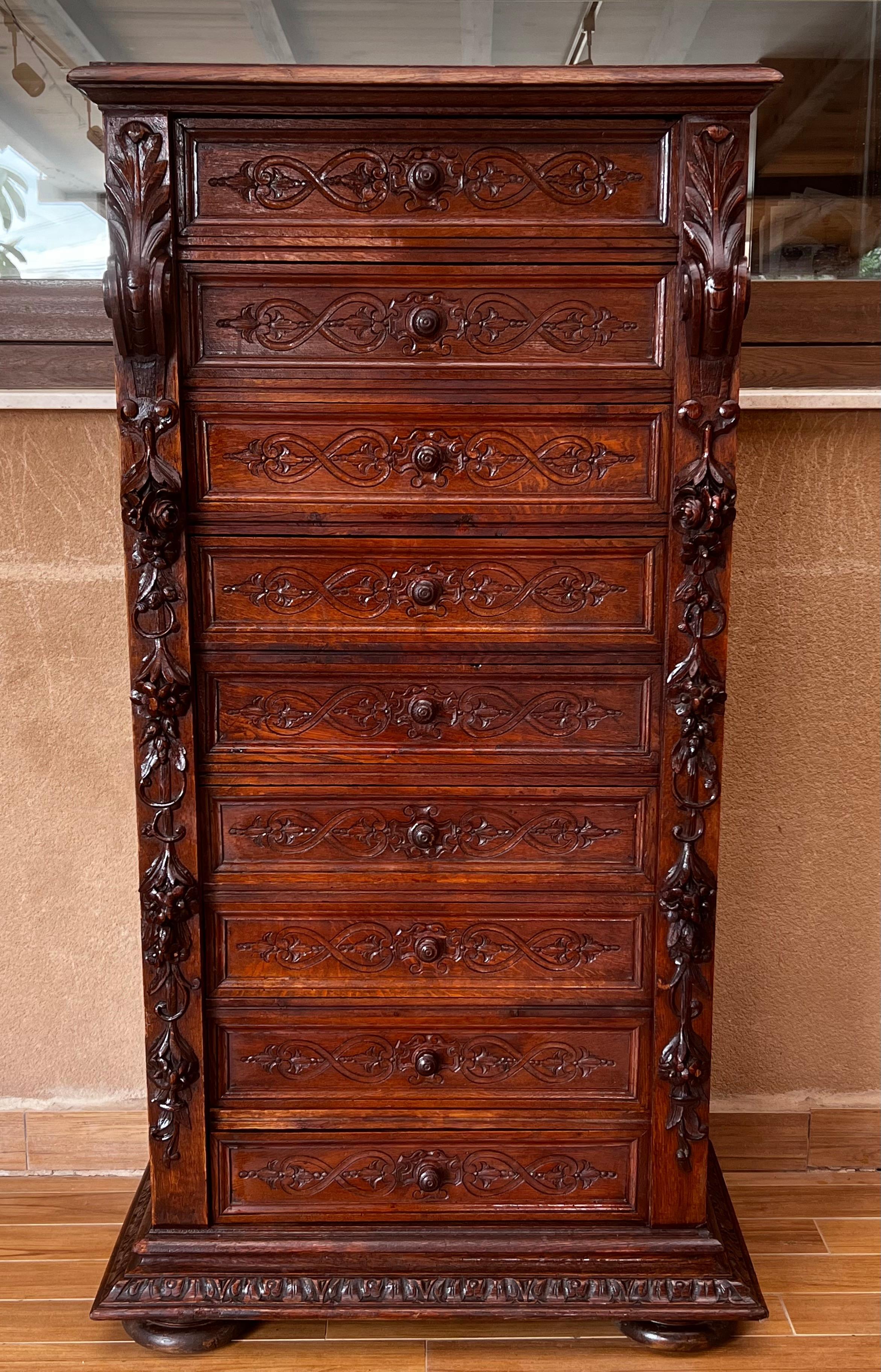 Extremely sturdy, almost completely original. Constructed using mortis and Tenon joints, horse glue and forged iron nails. Uprights are heavily carved with hanging garland and scroll motifs. Drawer fronts are adorned with flattened foliage carved in