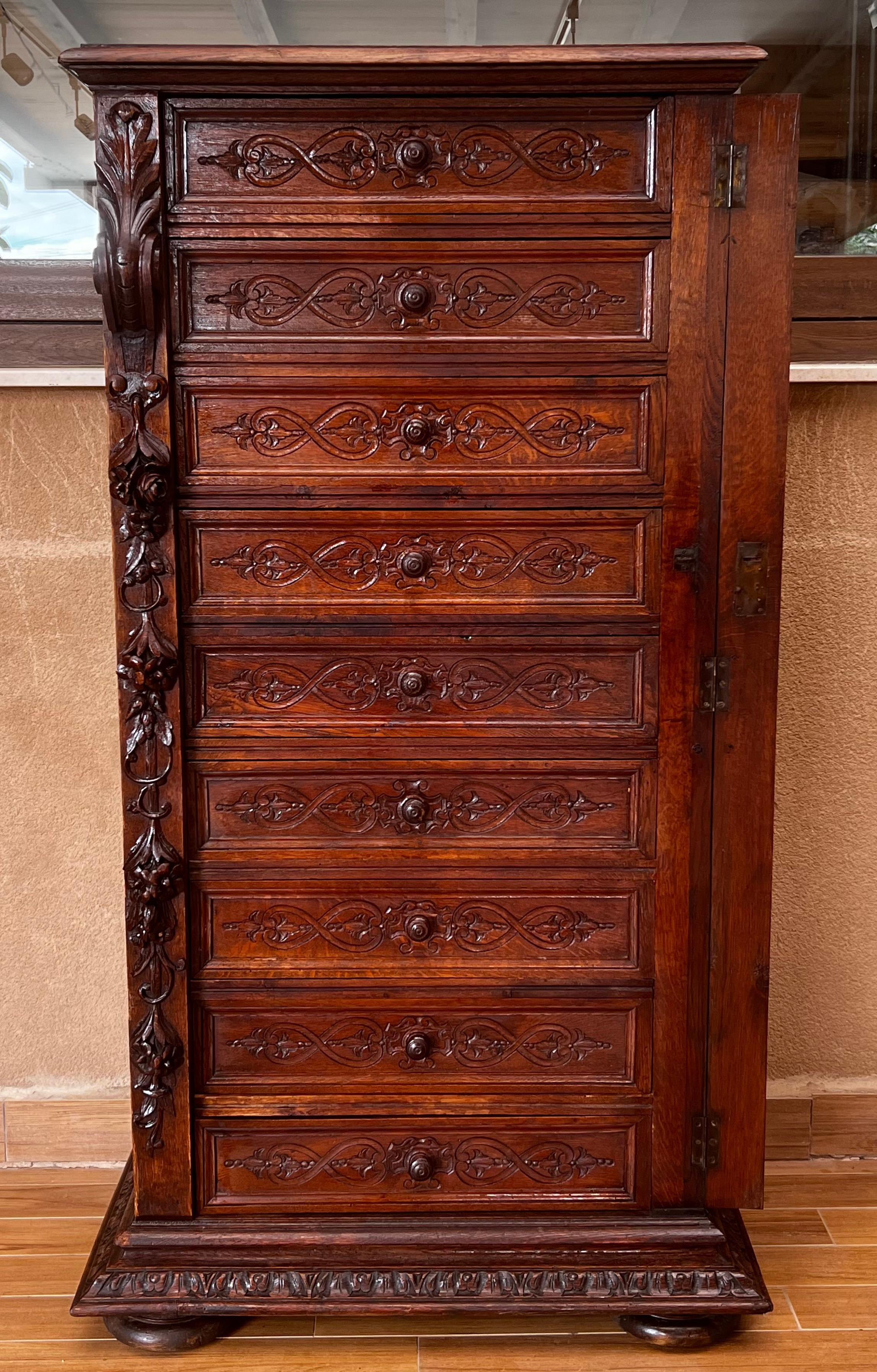 Spanish Late 19th Walnut Nine Drawer Tall French Carved Chest or Siffonier For Sale