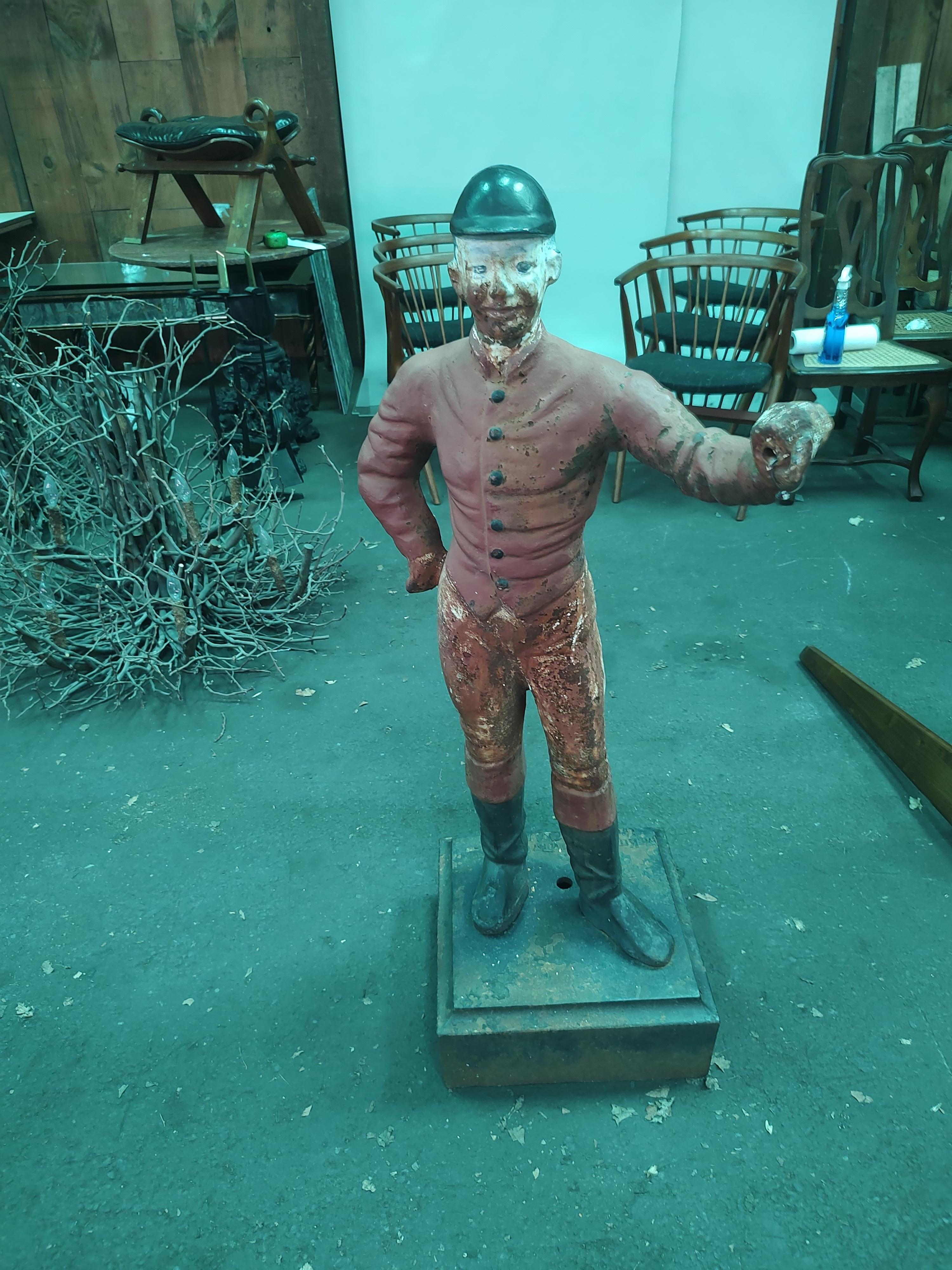 Tall elegant cast iron lawn jockey by the Scott McKittrick foundry located in Union Beach NJ during the latter part of the 19th century. In excellent antique condition with no damage cracks or breaks. Just normal age related wear to the surface.
