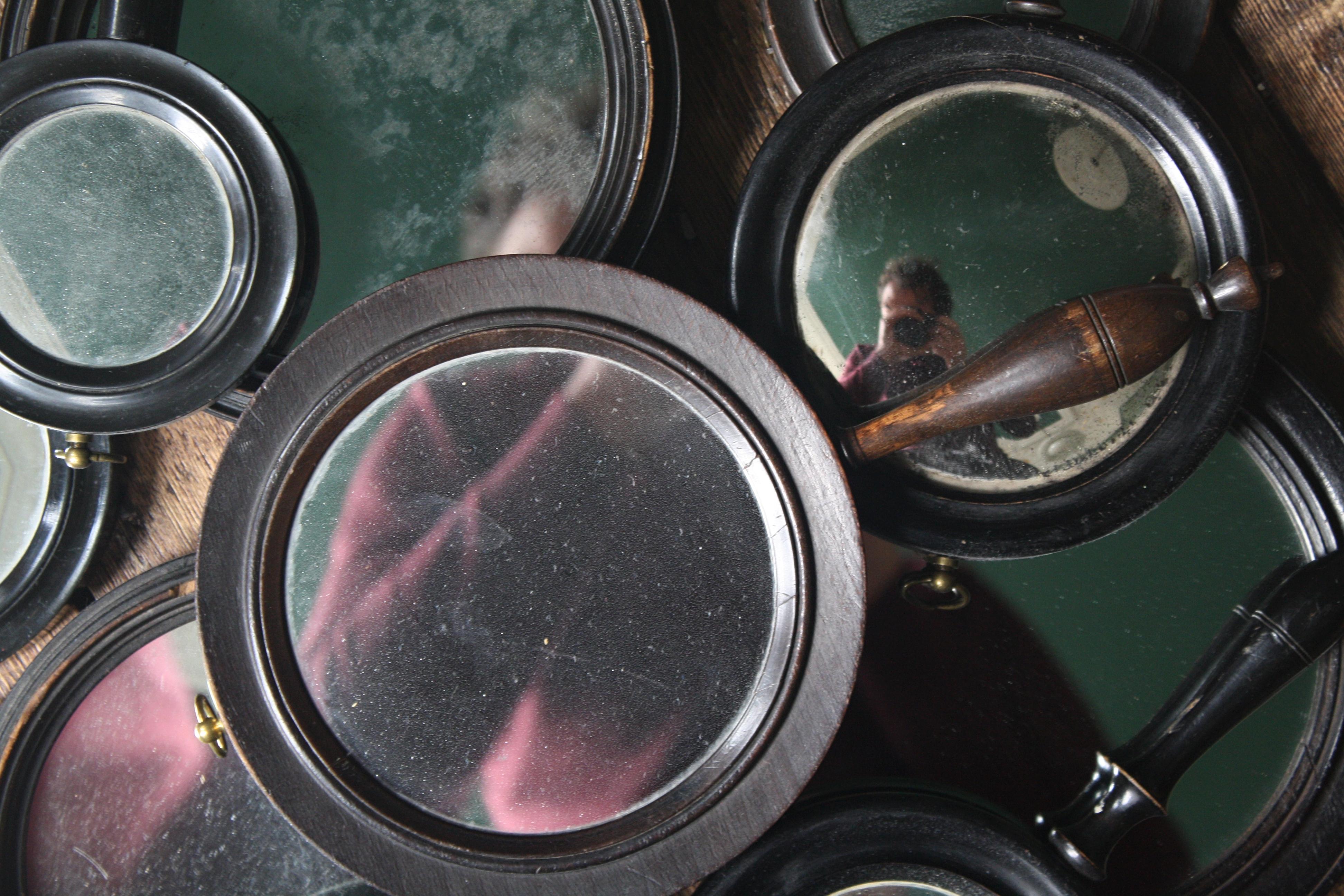 Here we have a rare collection of 10 late 19th century ebonised scientific mirrors.
All with original turned handles, produced in hardwood and with original ebonised finish. Some have doubled sided mirror plates, some with mercury plates convex,