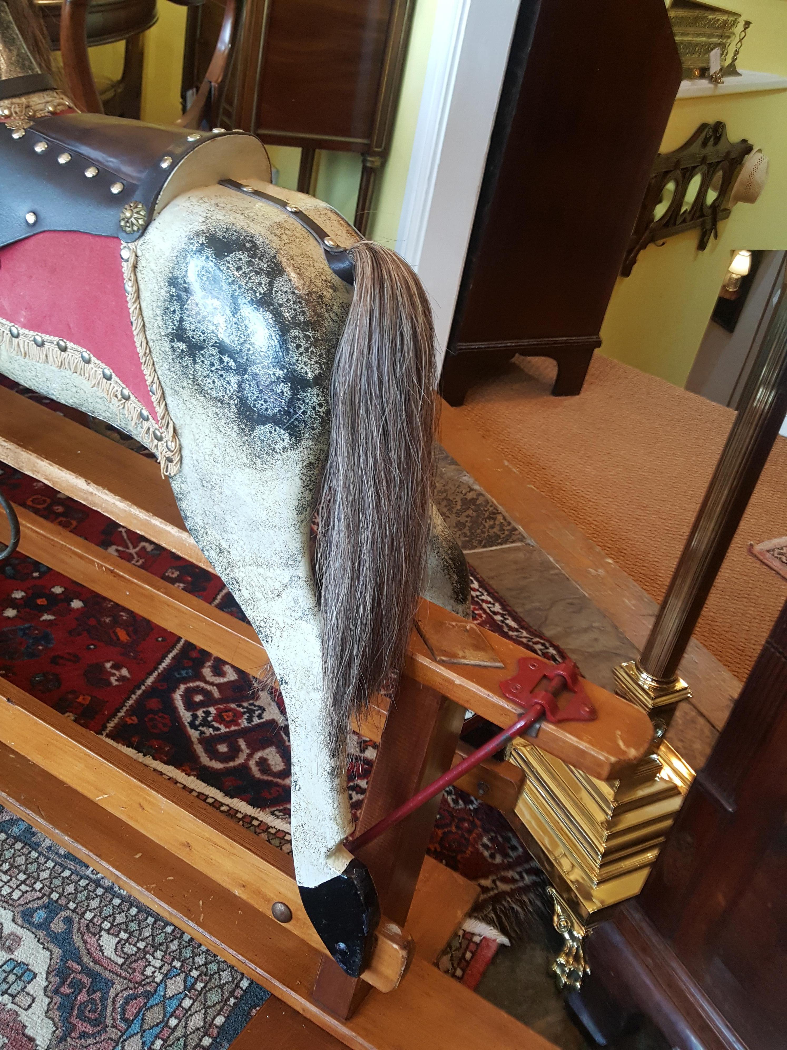 Late 19th-early 20th century Collinson rocking horse of dappled form with glass eye and horsehair mane and tail – 50