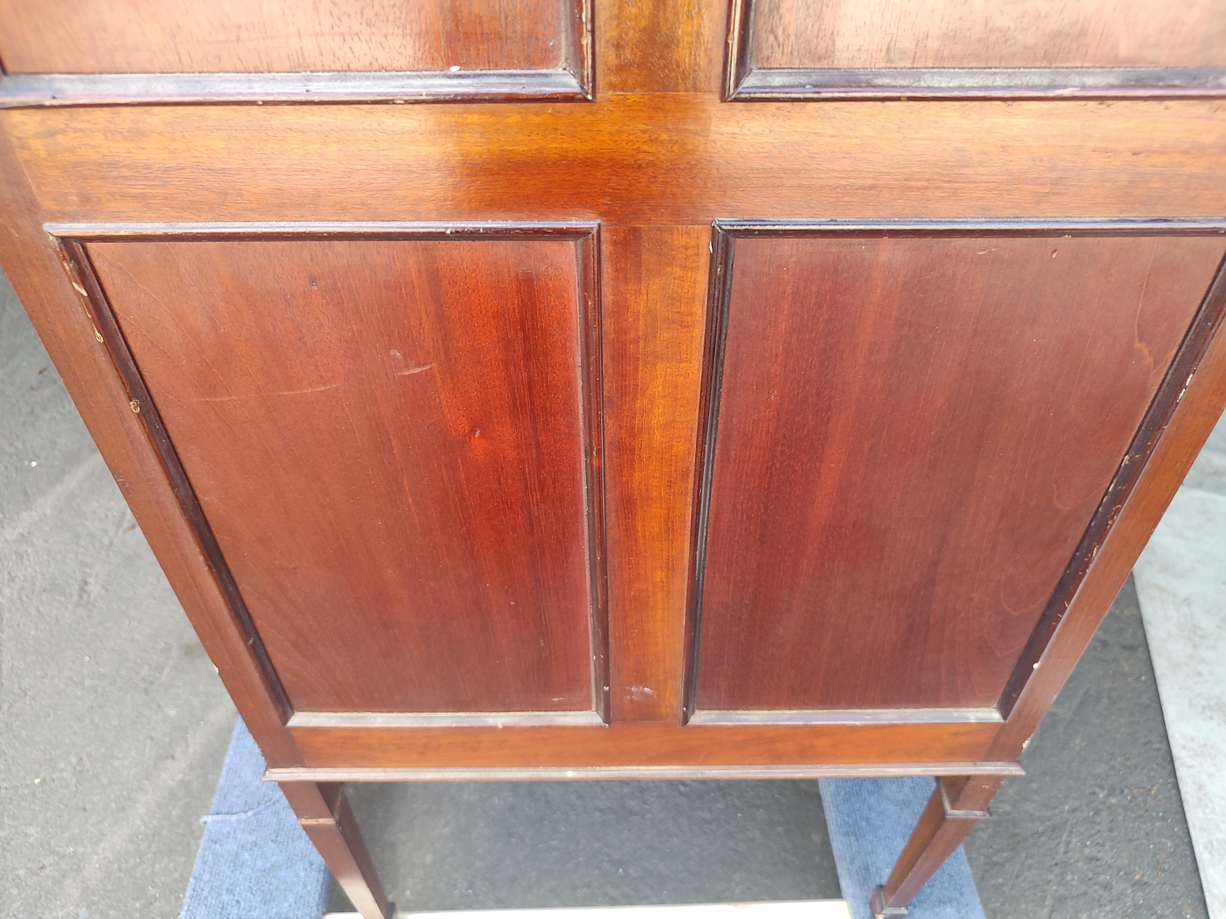 A very elegant mahogany sheet music cabinet with banding & inlay. Drop down drawer fronts which reveal oak pull out sliding drawers. Perfect candidate for reuse, great size for a bathroom or entryway. In excellent antique condition with minimal