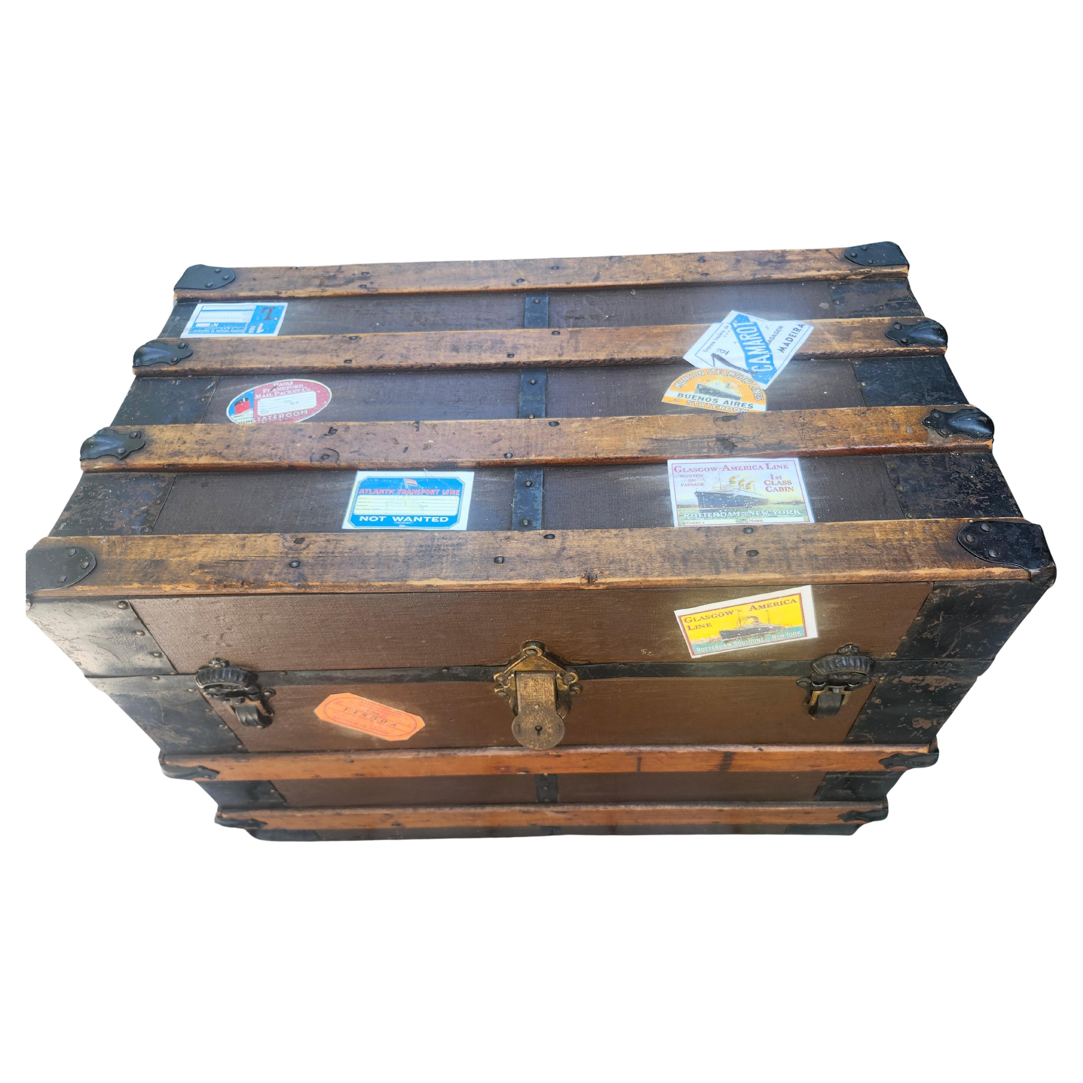 Fabulous steamer trunk from the late 19th century in spectacular condition with London - New York stenciled on its sides and reproduction travel stickers on top and sides also. They can be easily removed. Complete trunk with all its necessary