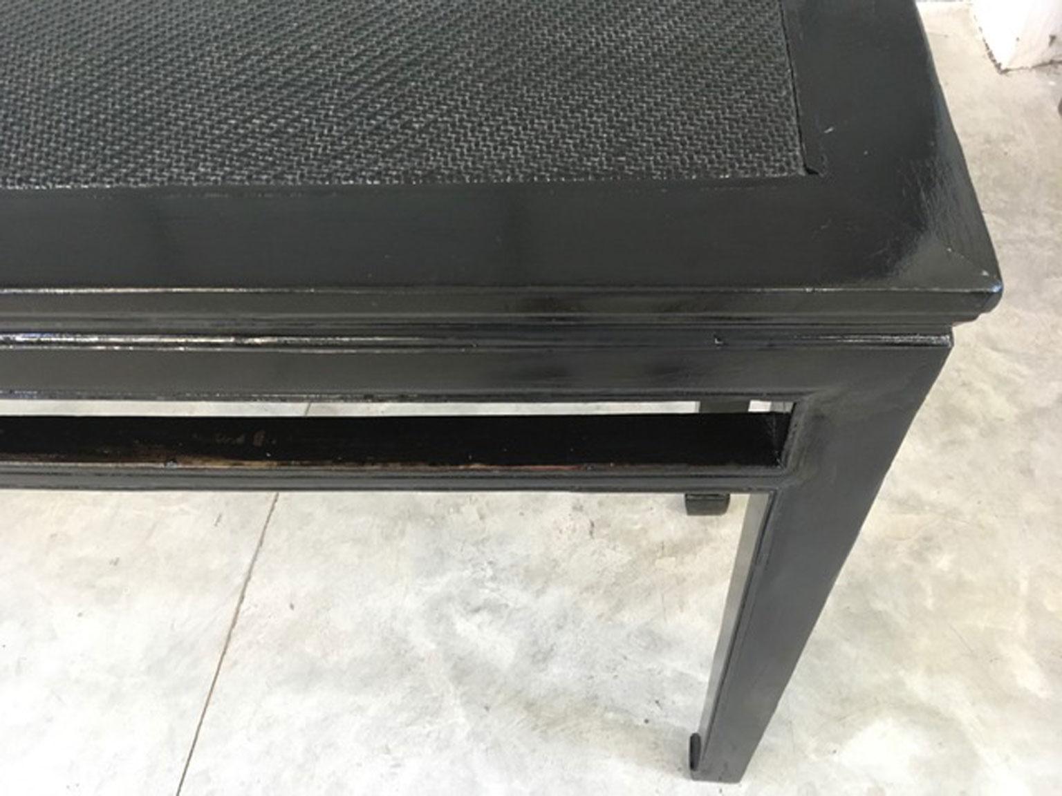 This console is an hand crafted piece of furniture and was made in elm wood, typical of asian countries in Late 19th Century. It was cleaned and refreshed the old black finish.
This is a very contemporary piece for its simply line and black color