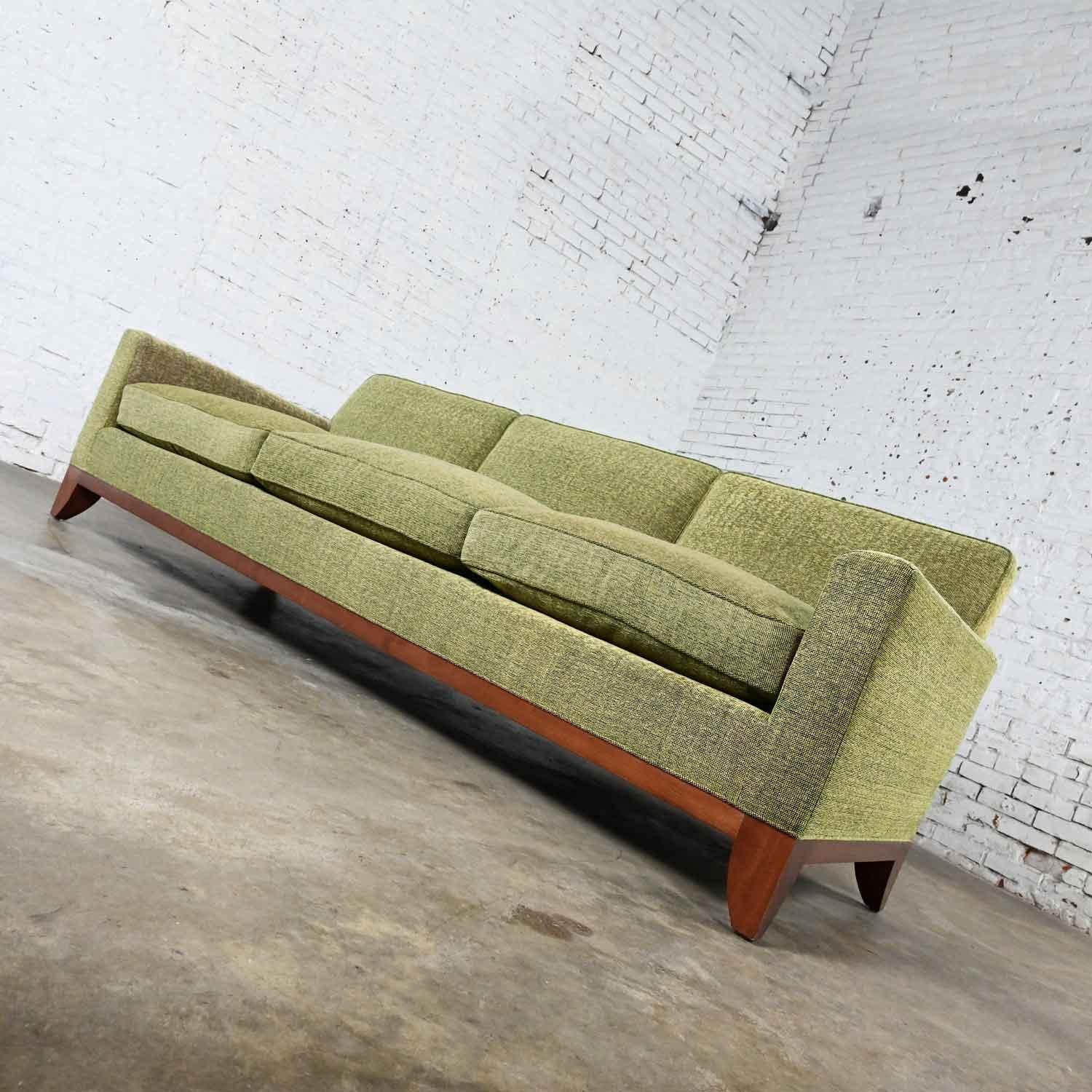 Stunning vintage Modern custom made Lawson style large scale tight back sofa khaki with olive green overtones. Comprised of upholstered frames, feather down wrapped foam loose zippered seat cushions, square tapered legs, and light mahogany finished