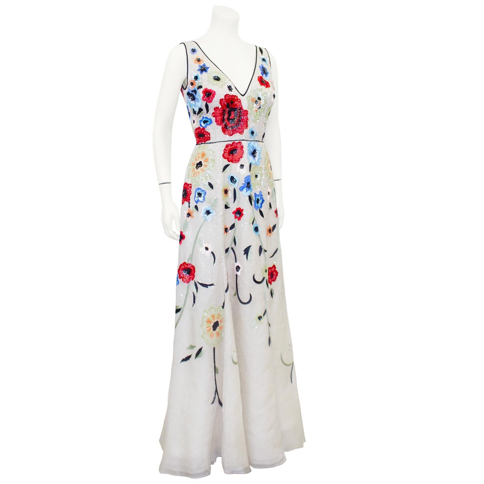Gorgeous Dennis Basso v neck floral beaded gown. Based out of NYC, Dennis Basso is a master of evening wear. The details on this beaded gown are immaculate. Off white organza layered gown with blue and red floral beading. Trimmed in black satin at