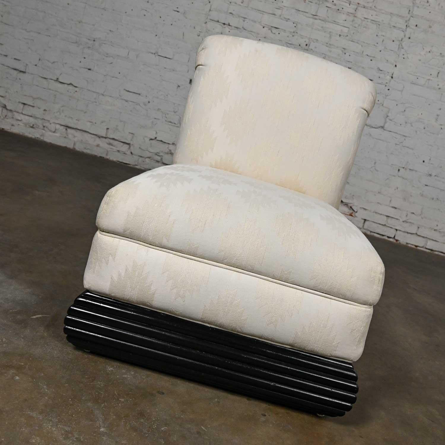 Lovely vintage Art Deco Revival white slipper chair with a rolled back and black ribbed wood base. Beautiful condition, keeping in mind that this is vintage and not new so will have signs of use and wear. The base has been freshly painted black. The
