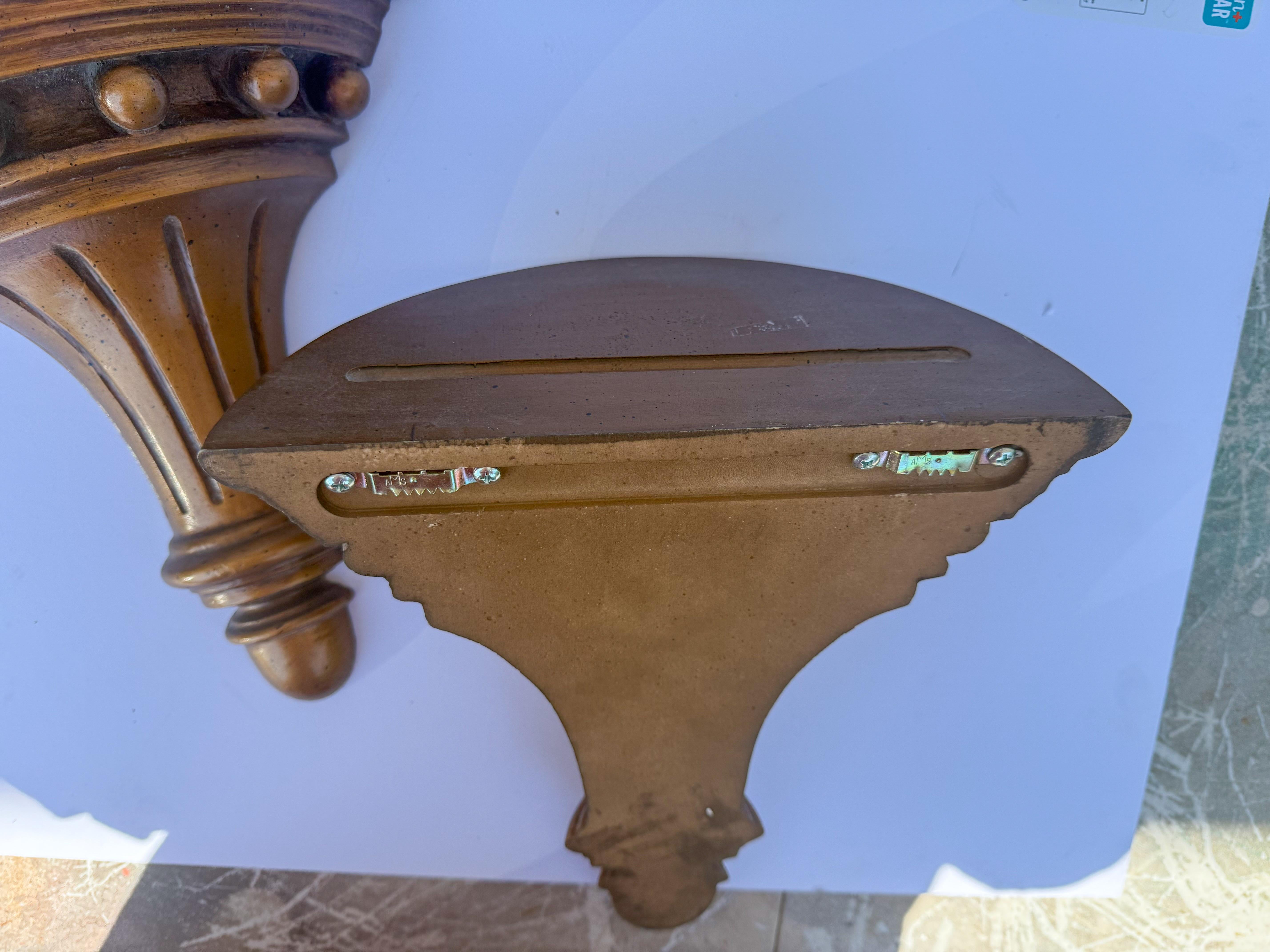This is a pair of Federal style gilt composition wall brackets. They have an indentation for plates. They are unmarked and in very good condition. 