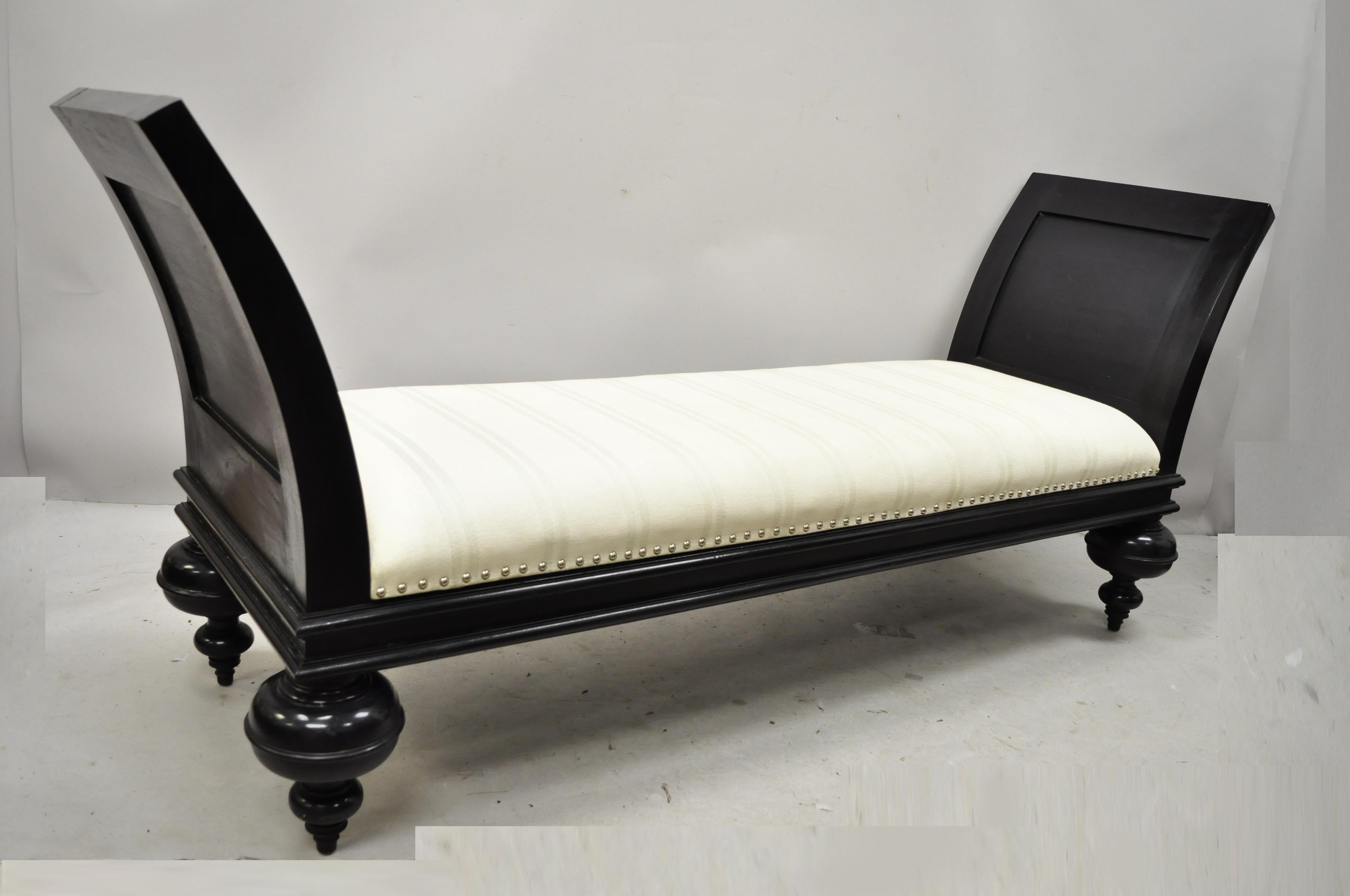 Late 20th century Hollywood Regency Italian style large black bun feet window bench. Item features burlap upholstered seat with green stripes, turn carved bun form feet, flared arms, black distressed finish, very nice item, great style and form,