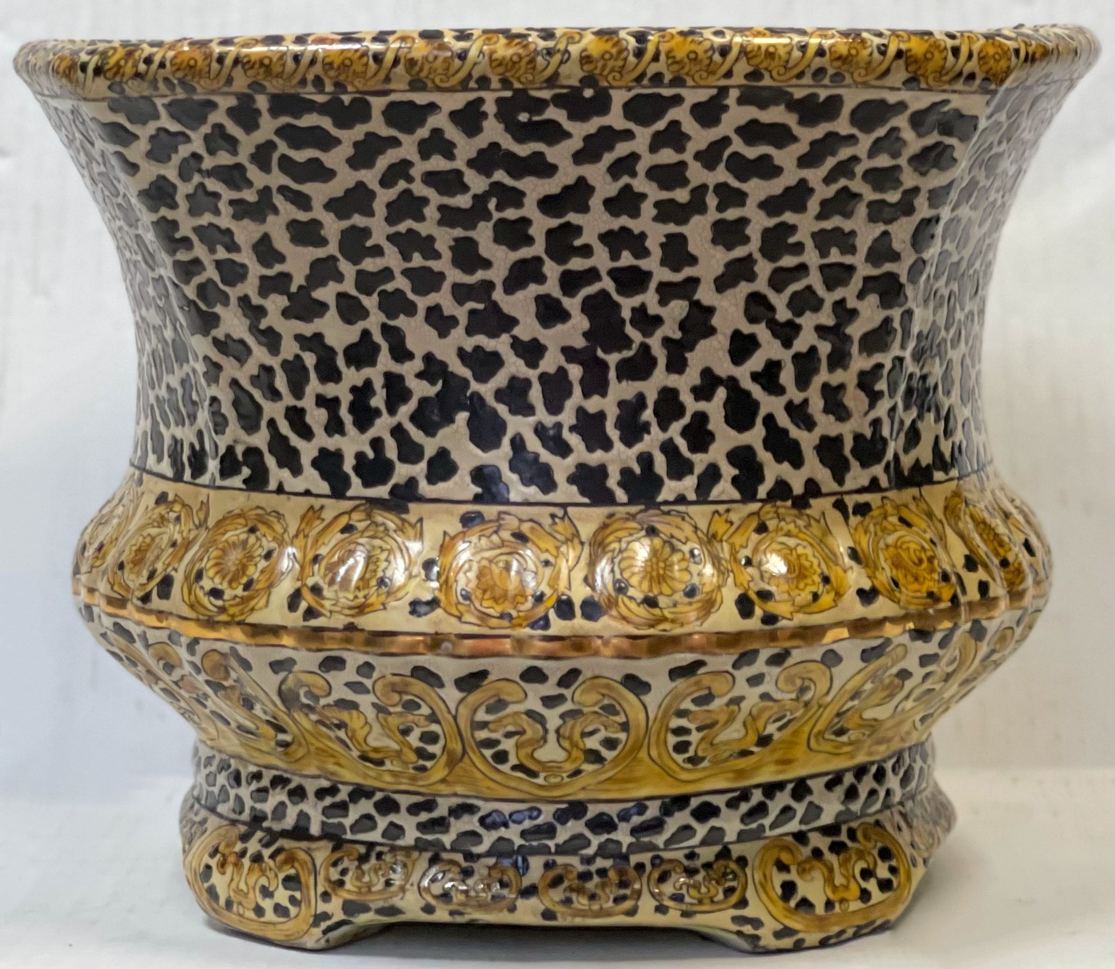 So fun and decorative. This is a large scale Chinese leopard motif planter. It could be used for a variety of things ranging from planter to ice bucket! It is ceramic and marked on the underside.