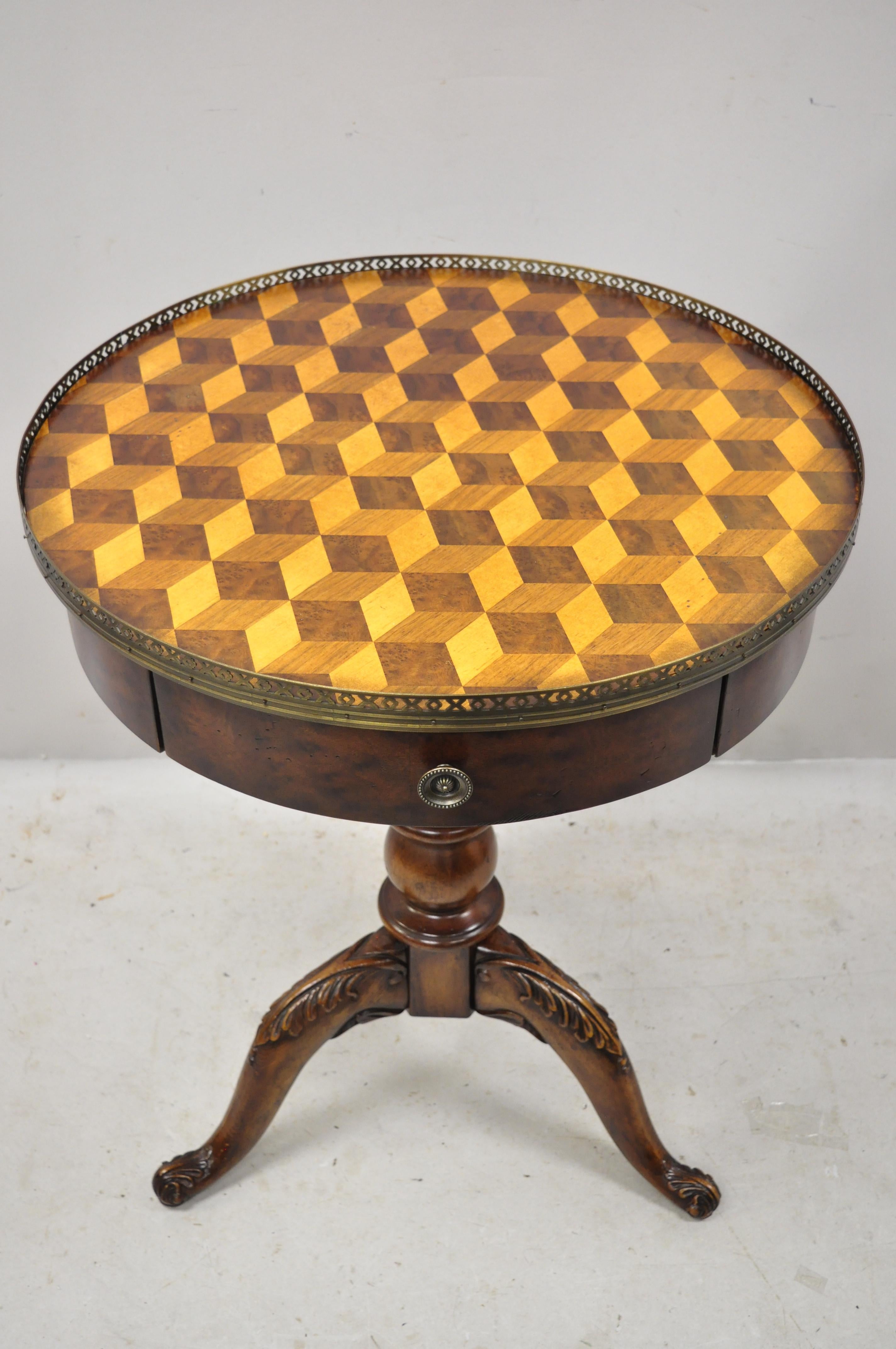 Late 20th century marquetry geometric inlay Regency style round lamp side drum table. Item features 3 dimensional design marquetry inlaid geometric top, nicely carved details, 1 drawer, very nice item, great style and form, circa 21st century.