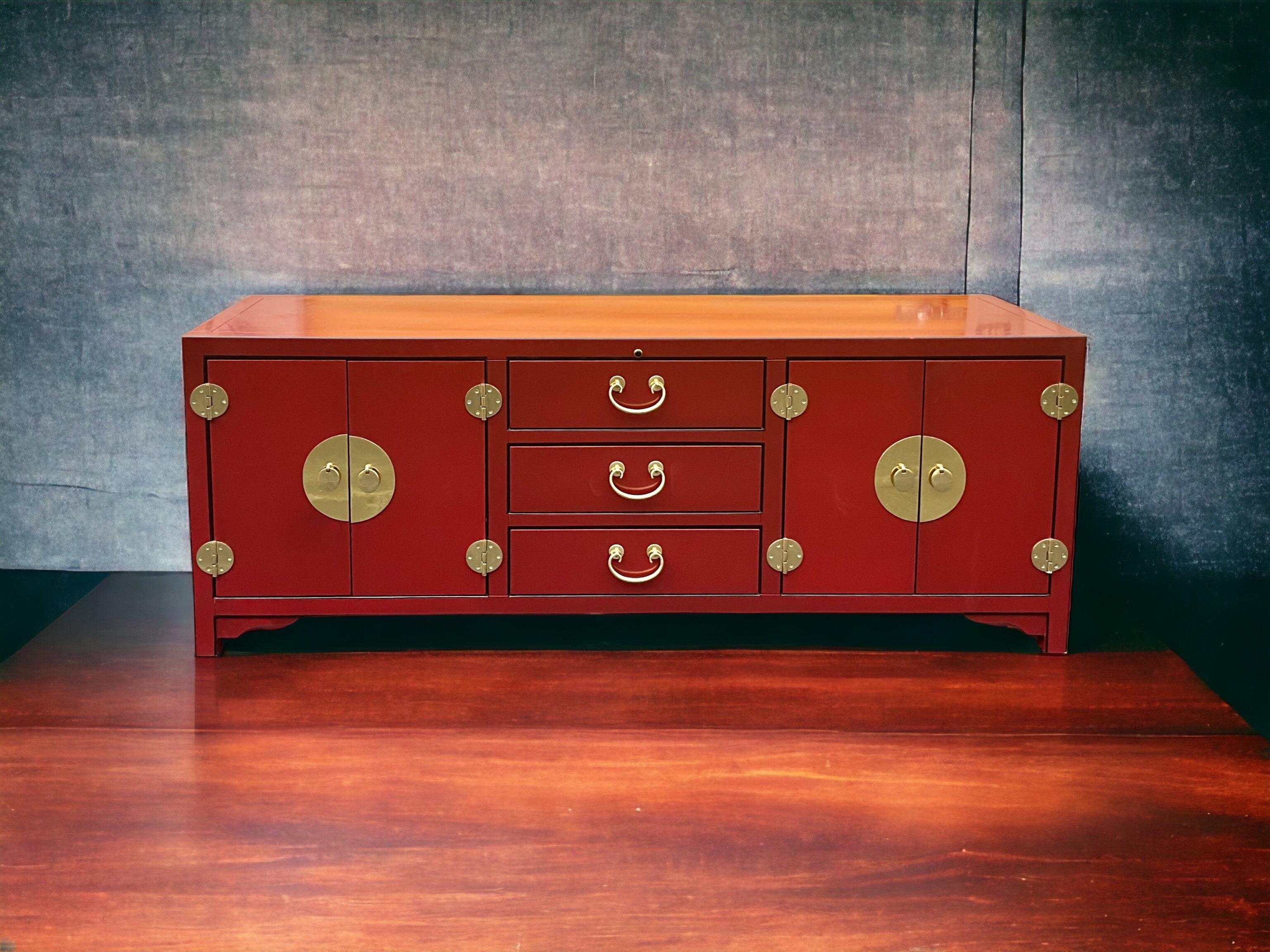 This is a killer credenza! It has Asian styling with decorative brass hardware. The red lacquer finish is piped in black. It has quite a bit of storage and is in very good condition.

My shipping is for the Continental US only and is running two to