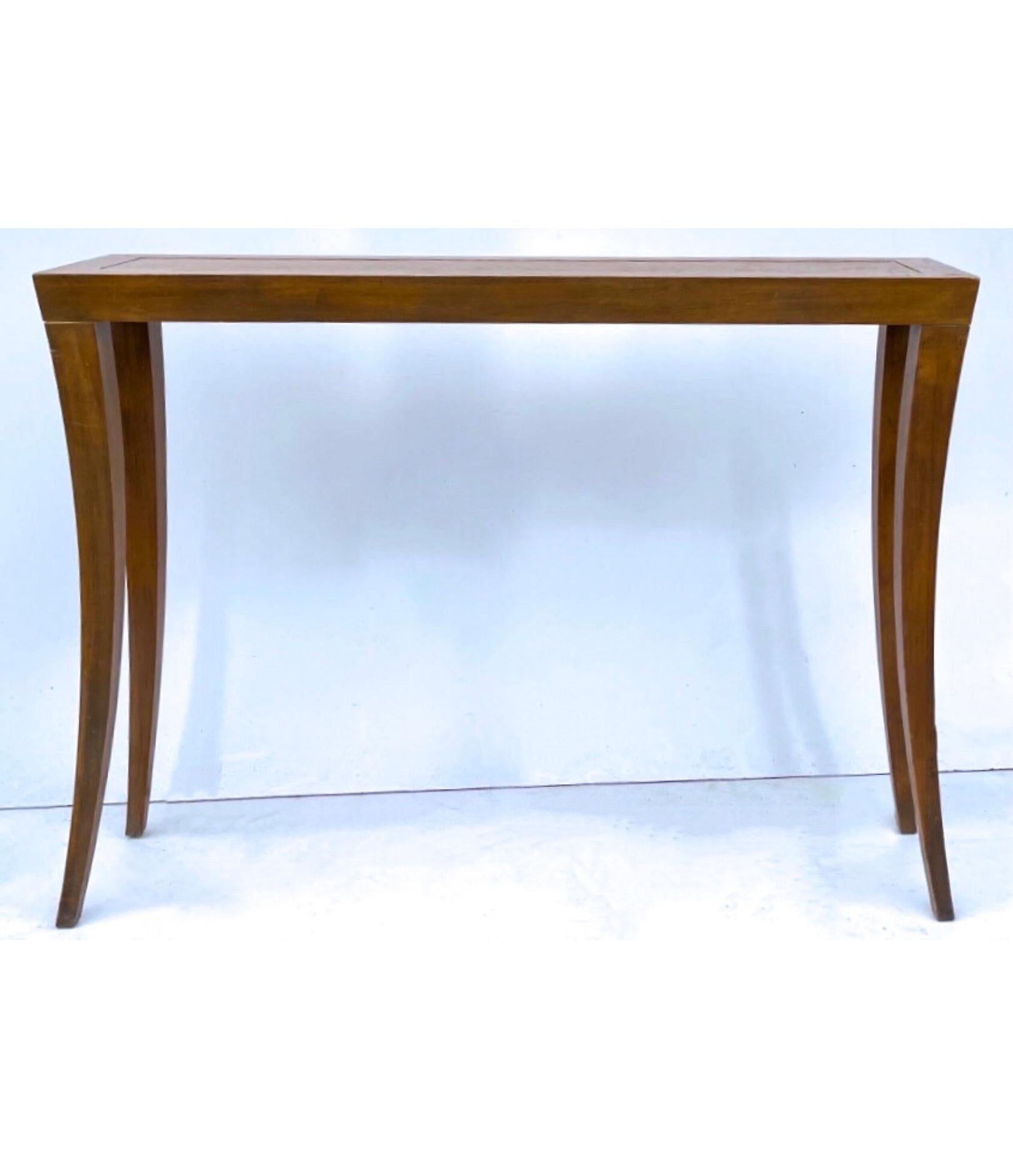 This is a pair of modern mahogany console tables by Hickory Chair Furniture Company. They are in very good condition. The clean lines make them versatile for a variety of home decor options.