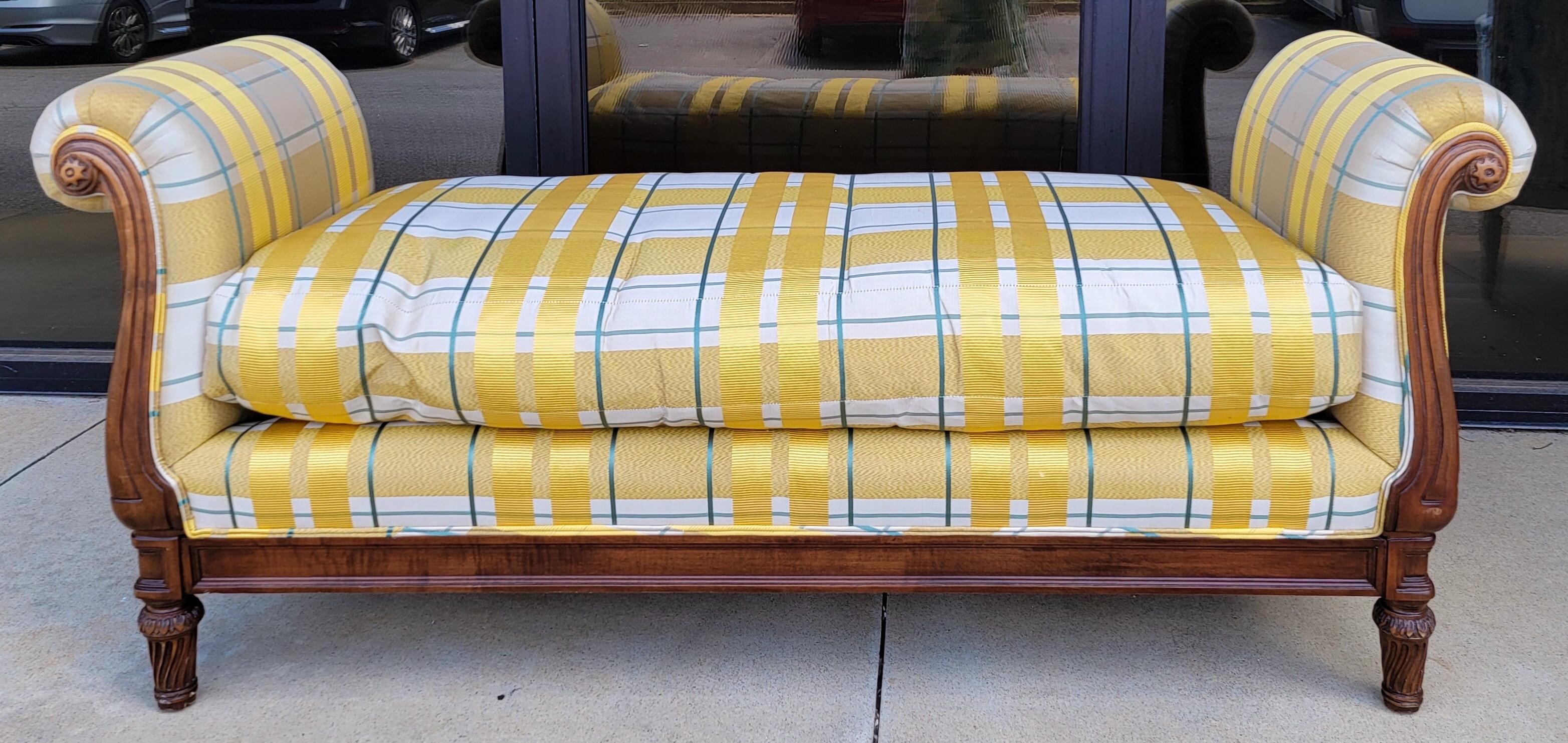 Lovely in yellow! This is a late 20th century regency style carved mahogany bench or daybed. The yellow upholstery is in wonderful condition. The frame may have a little more age. The Mike Bell label is most likely the design firm. 

My shipping is