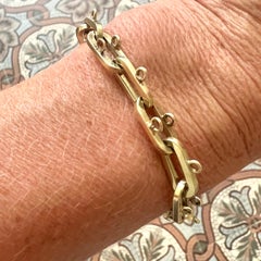 Pulsera de cadena con dijes de oro de 14 quilates de finales del siglo XX, 25,64 gramos