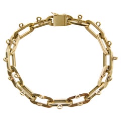 Fin du 20ème siècle, bracelet à breloques en or 14 carats, 25.64 grammes