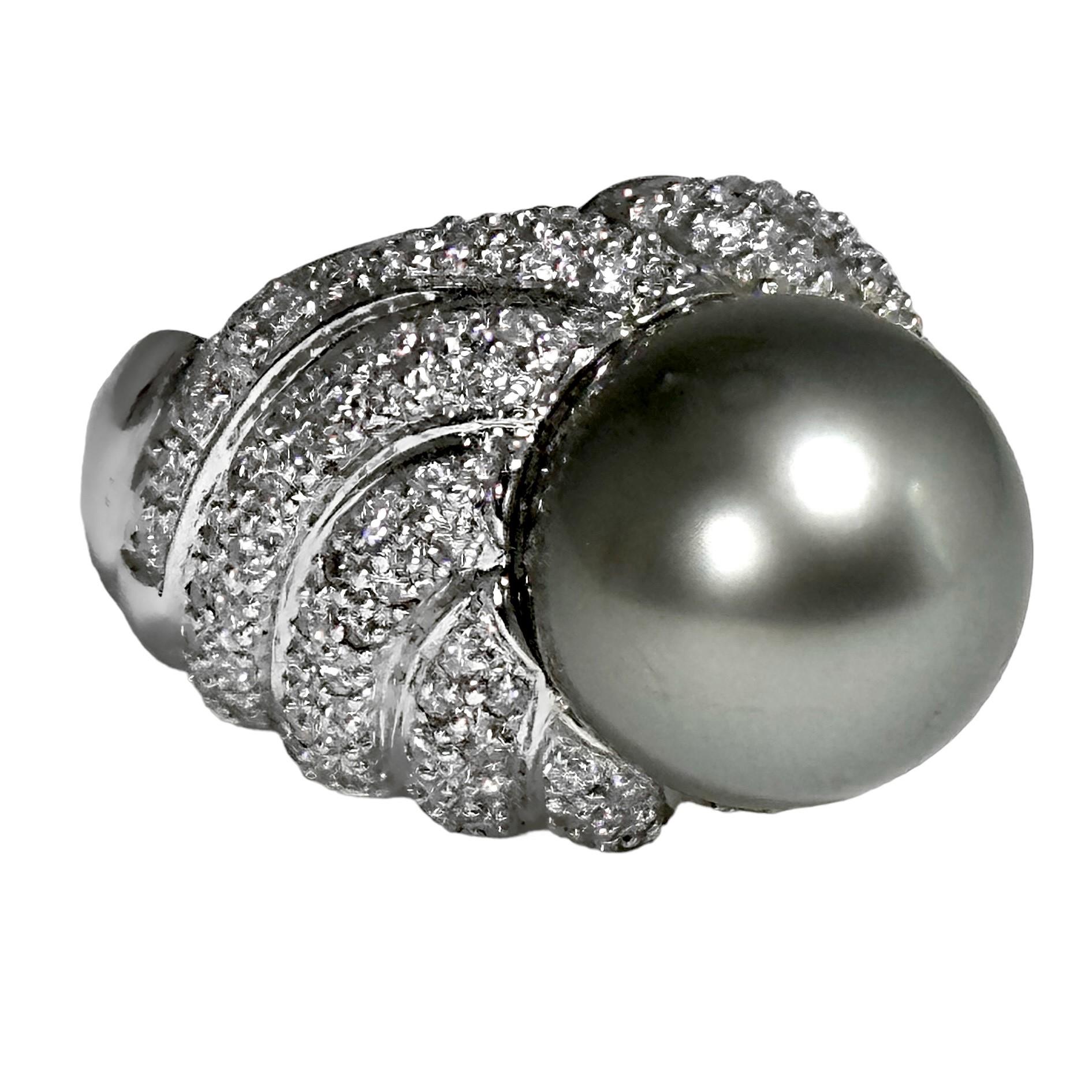 This bold and lovely 18k white gold vintage ladies cocktail ring features one central cultured 13.5mm diameter Tahitian cultured grey pearl, topping off eleven bombe swirls set with over 135 brilliant cut diamonds, having a total approximate weight