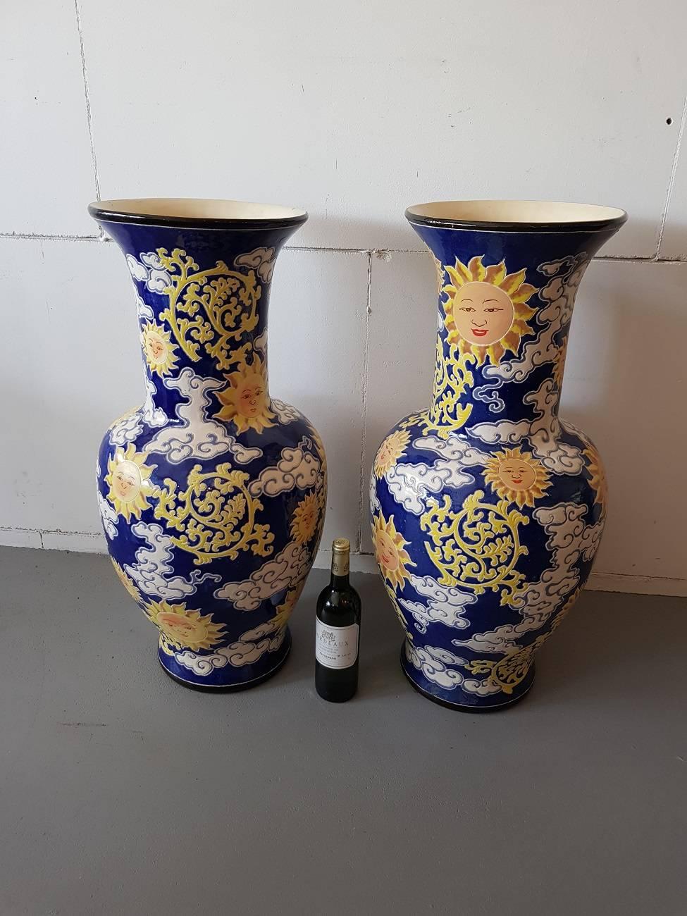 Set of two very decorative late 20th century French earthenware vases with hand-painted scenes of clouds with suns (both are in mint condition).

The measurements are,
Depth 37 cm/ 14.5 inch.
Width 37 cm/ 14.5 inch.
Height 80 cm/ 31.4 inch.
 