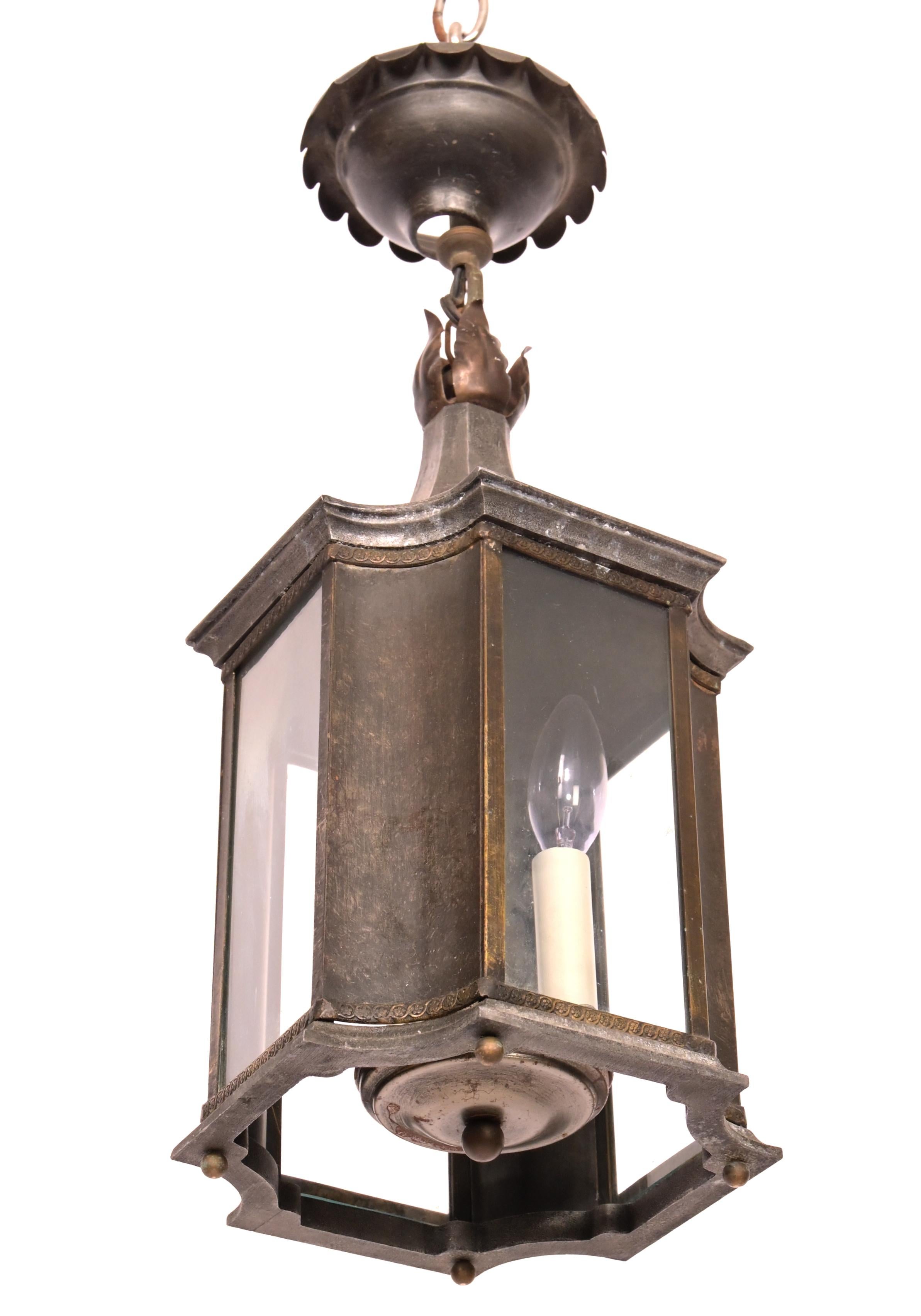 A small scale 3 light pagoda formed lantern. The dark pewter finish metal frame having shaped sides and fitted with 3 light electric cluster each with candelabra sockets or 60 watts Max

Additional cost for UL wiring
