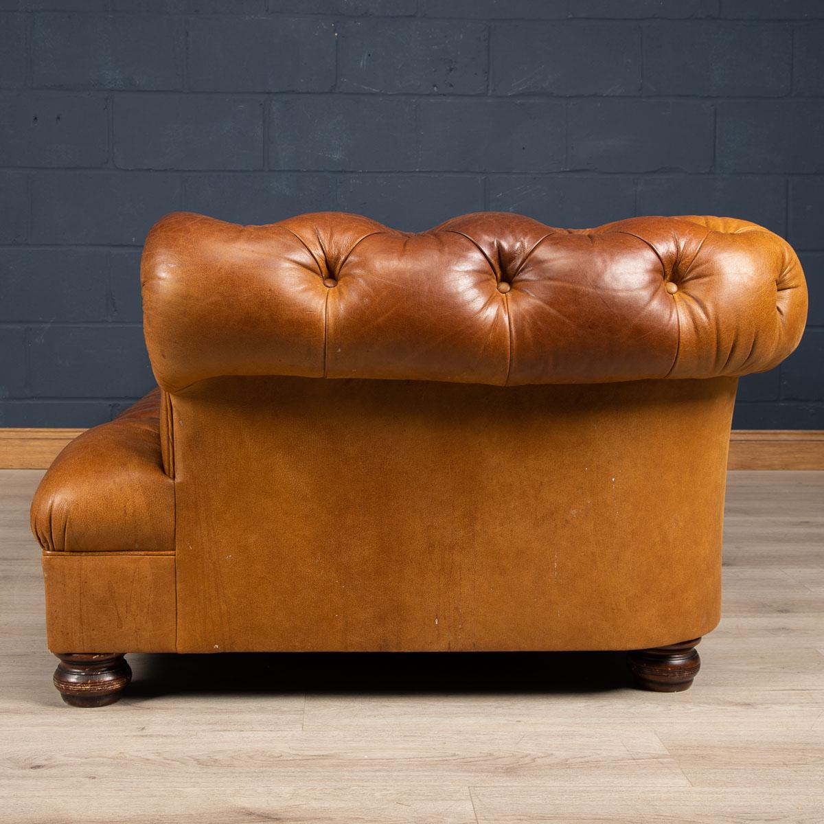 Superb late 20th century leather Chesterfield sofa. One of the most elegant models with button down seating, this fashionable item of furniture is capable of uplifting the interior space of any contemporary or traditional home, the Classic color
