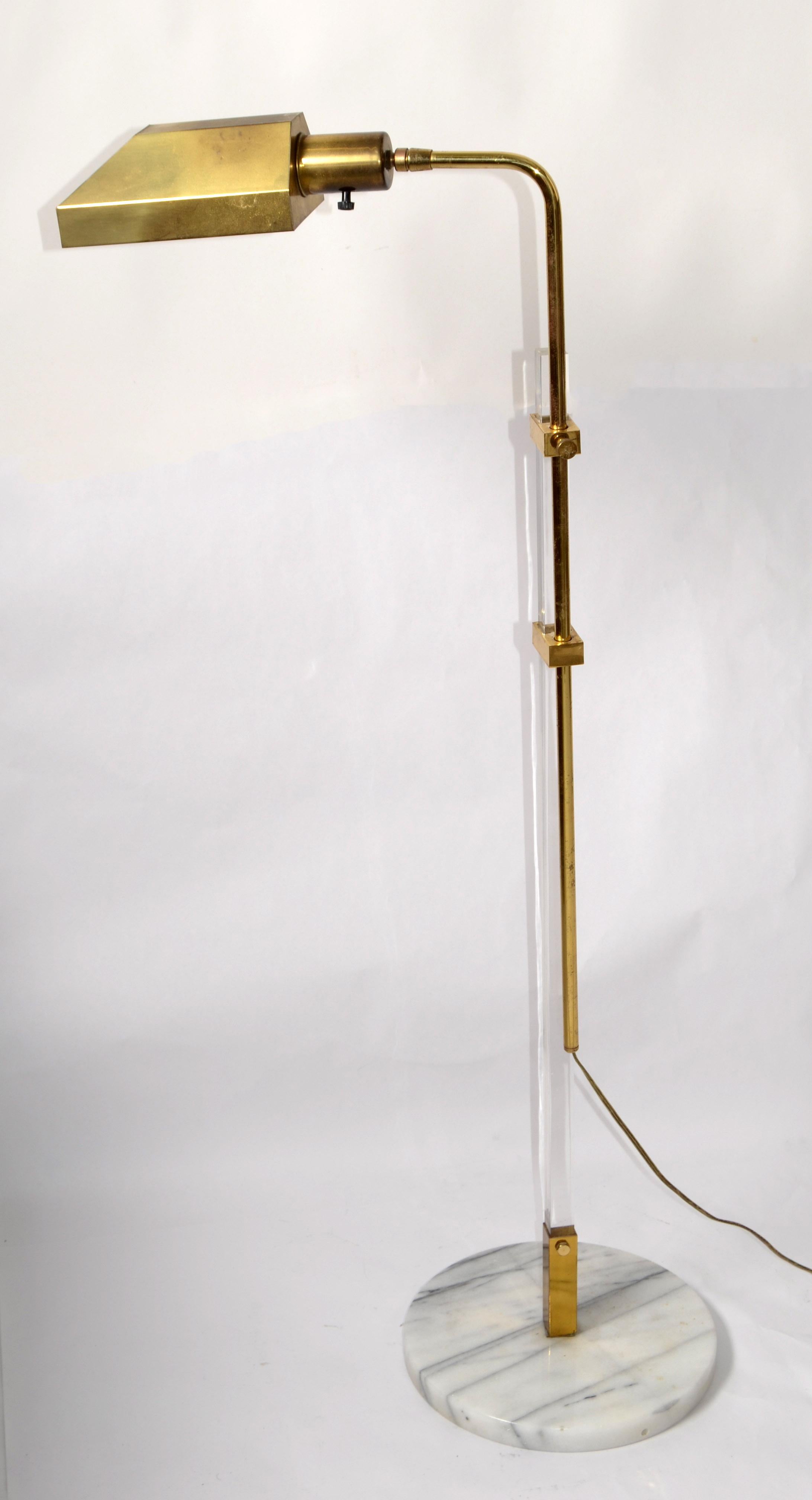 Italian 18 inches adjustable Floor Lamp of Lucite and Brass. The Lamp features a rectangular vertical shaft of solid transparent Lucite on a round white-gray marble base, which is coupled with an adjustable tubular brass vertical shaft.
In perfect