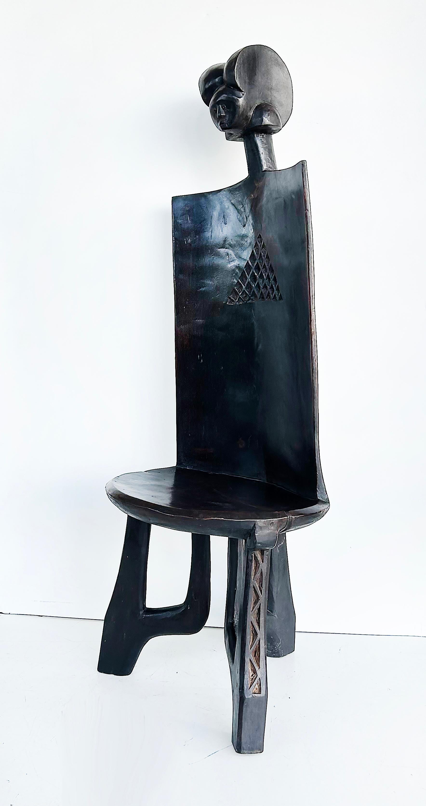 Late 20th Century African Carved Throne Chair, Makonde People of Tanzania

Offered for sale is a late 20th century beautifully carved throne chair from the Makonde people of Tanzania.  This stately chair is carved from a single piece of wood after