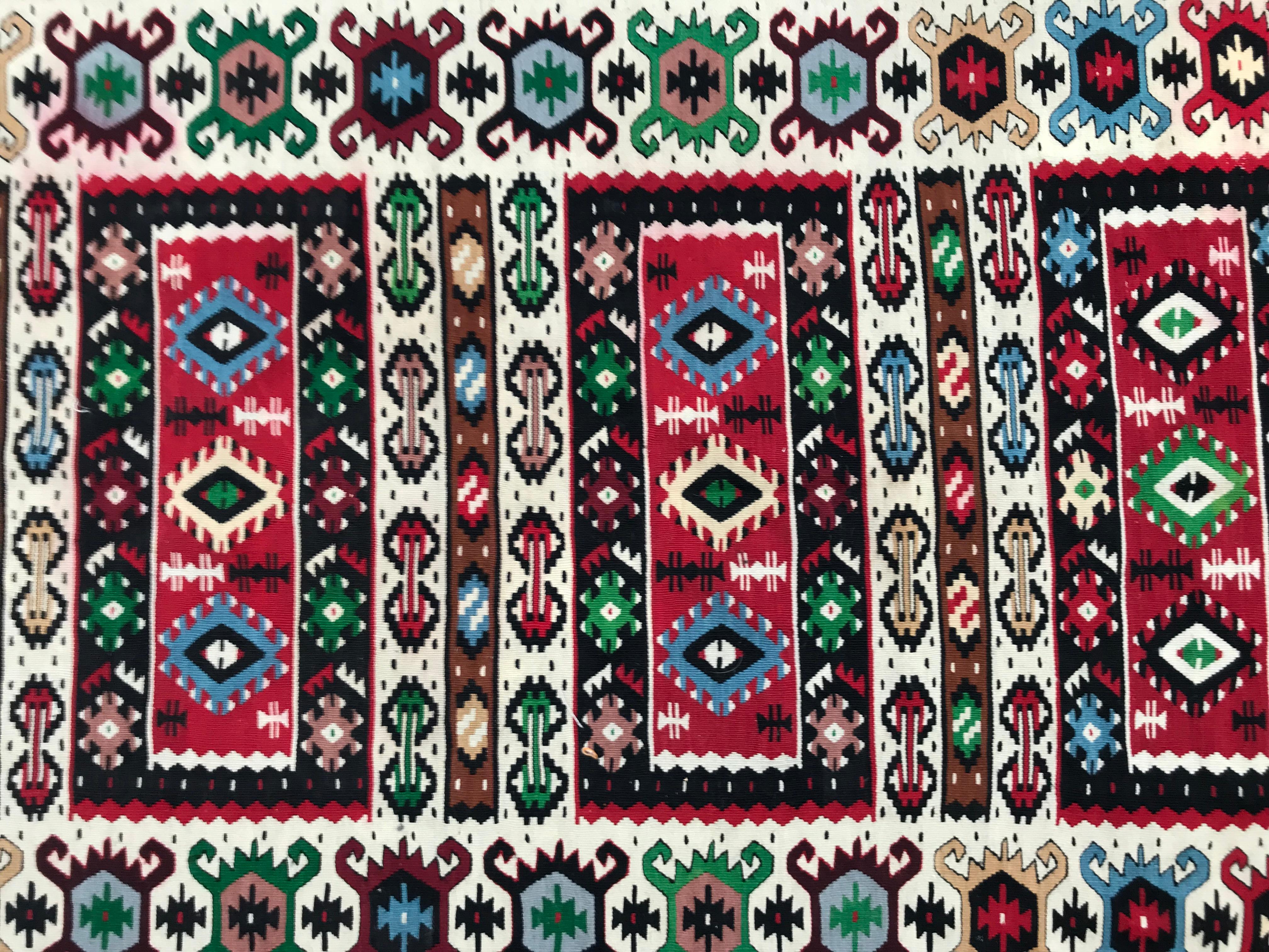 Discover the elegance of a 20th-century Turkish Kilim – a stunning piece adorned with intricate geometrical designs. Handwoven with care, this masterpiece features wool on a cotton foundation. Embrace the artistry of Turkish craftsmanship in every
