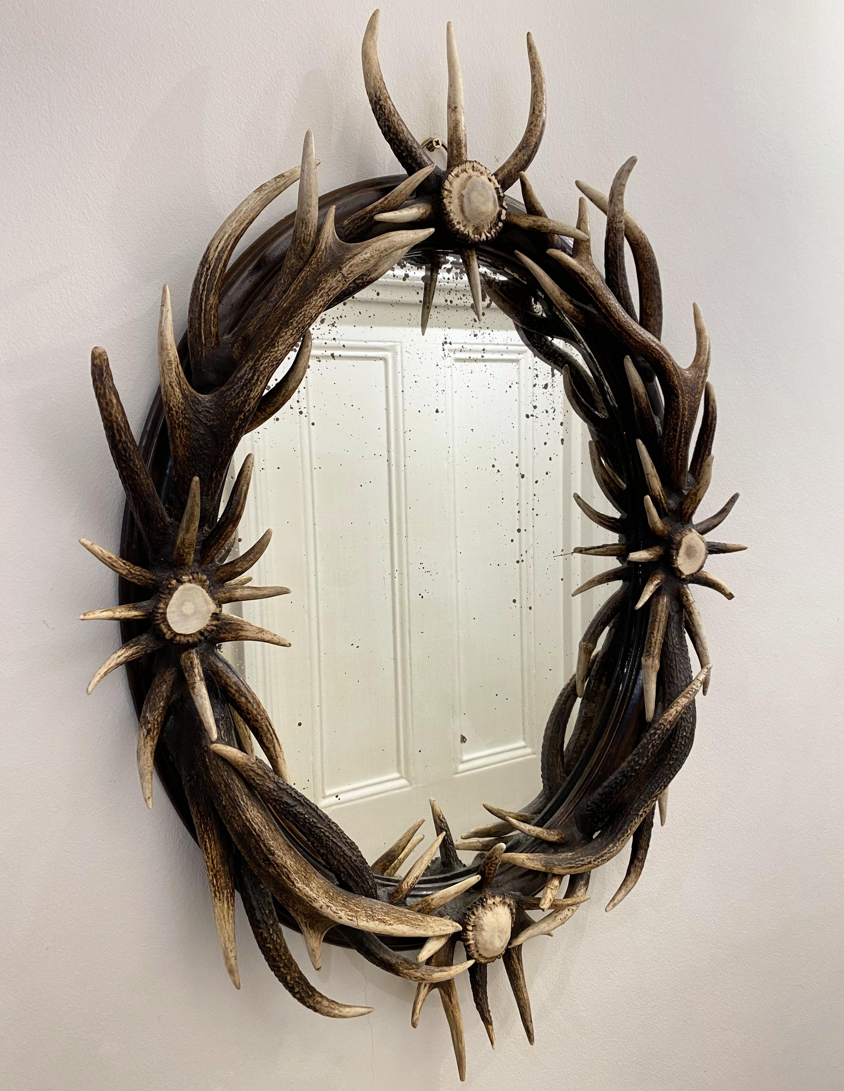 This stunning and original design oval wall mirror is comprised of naturally shed large red deer from Scotland. The individual natural beauty of the antler horn combined with the functionality and artistic design of the wall mirror makes this