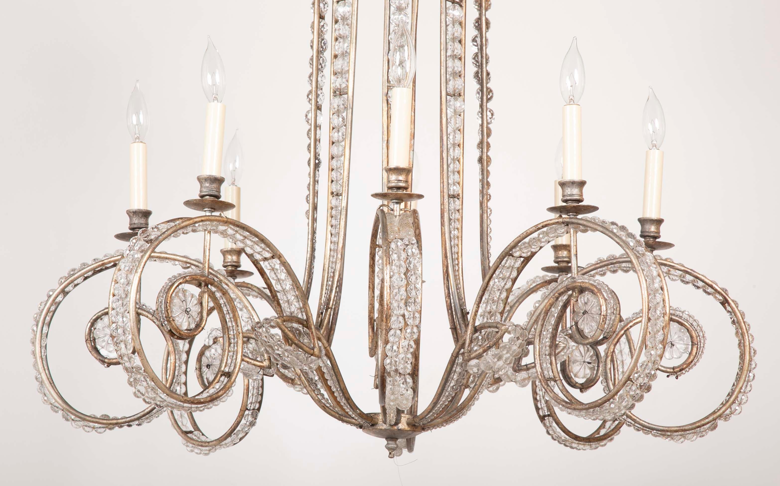 Late 20th century Bagues style chandelier of metal and glass having 8 candle lights.