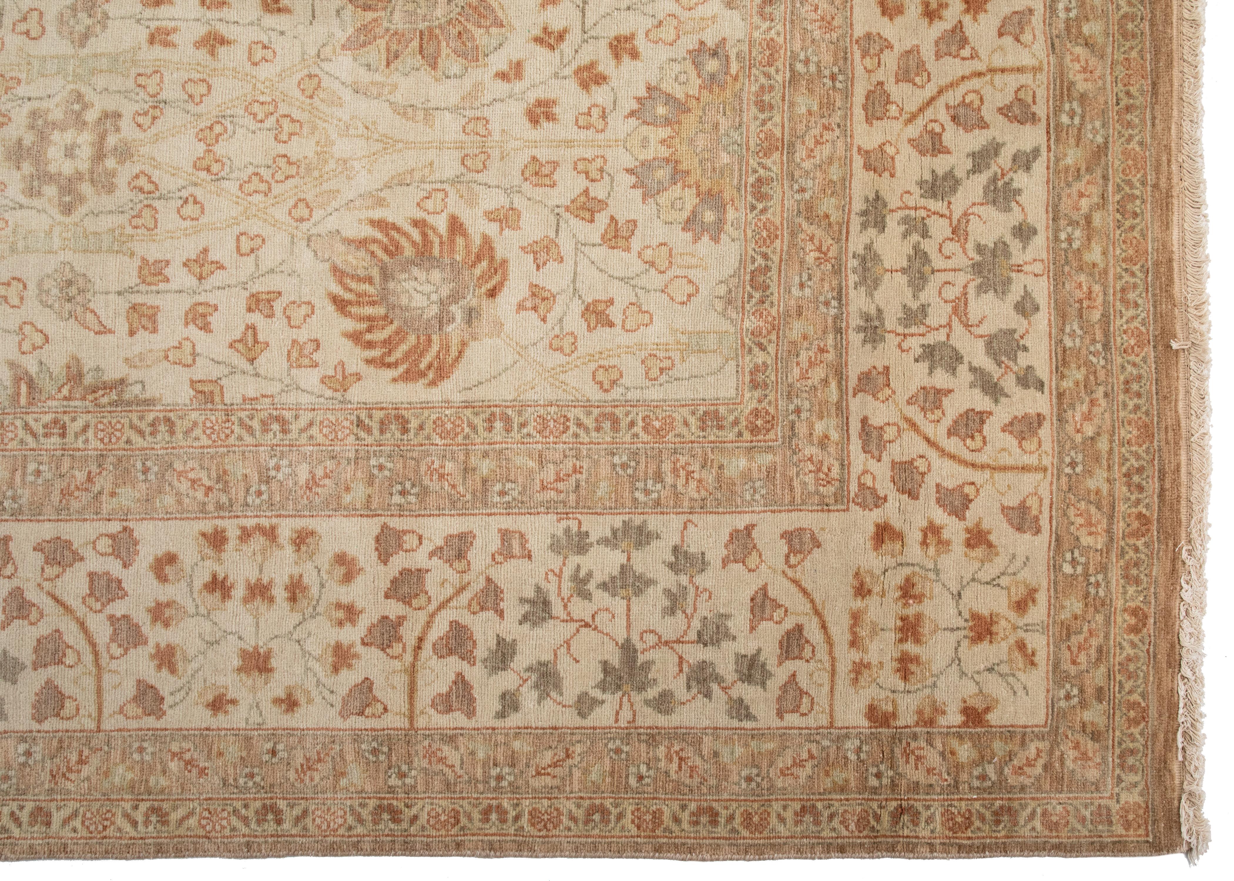 This is a new Egyptian rug in Persian Tabriz Design handwoven in Alexandria, Egypt in 1990s. We manufactured these rugs and the design and colors were hand chosen by us and we have a wide variety of sizes in this style. This one measures 9.2 x 12.1