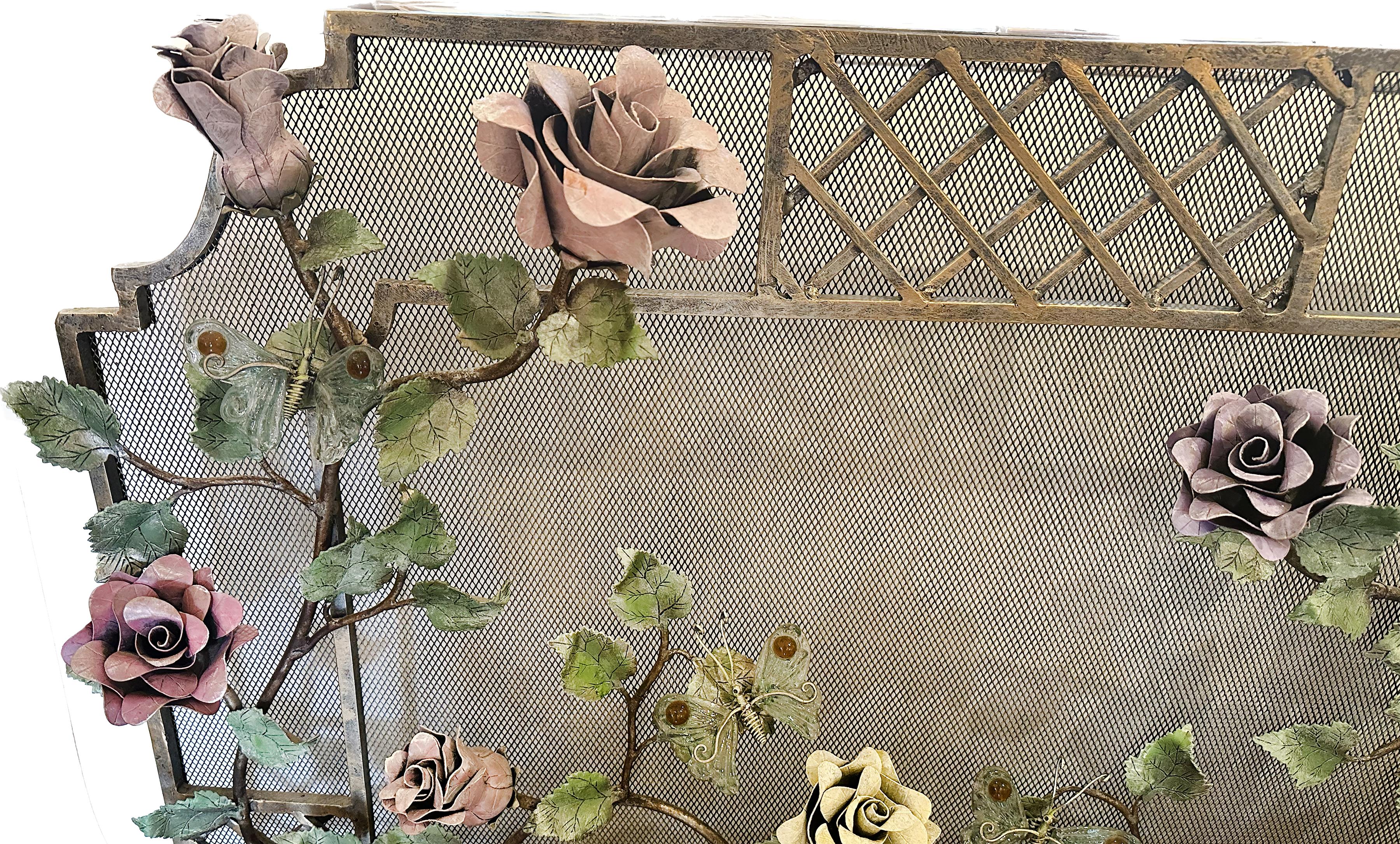 A stunning Late 20th century Bespoke Fireplace Screen. Heavy mesh with highly detailed ornate custom cast vines and roses. Vines and flowers are painted in a lacquer finish with a gold tinge. The flowers come in varieties of yellow, purple, red, and