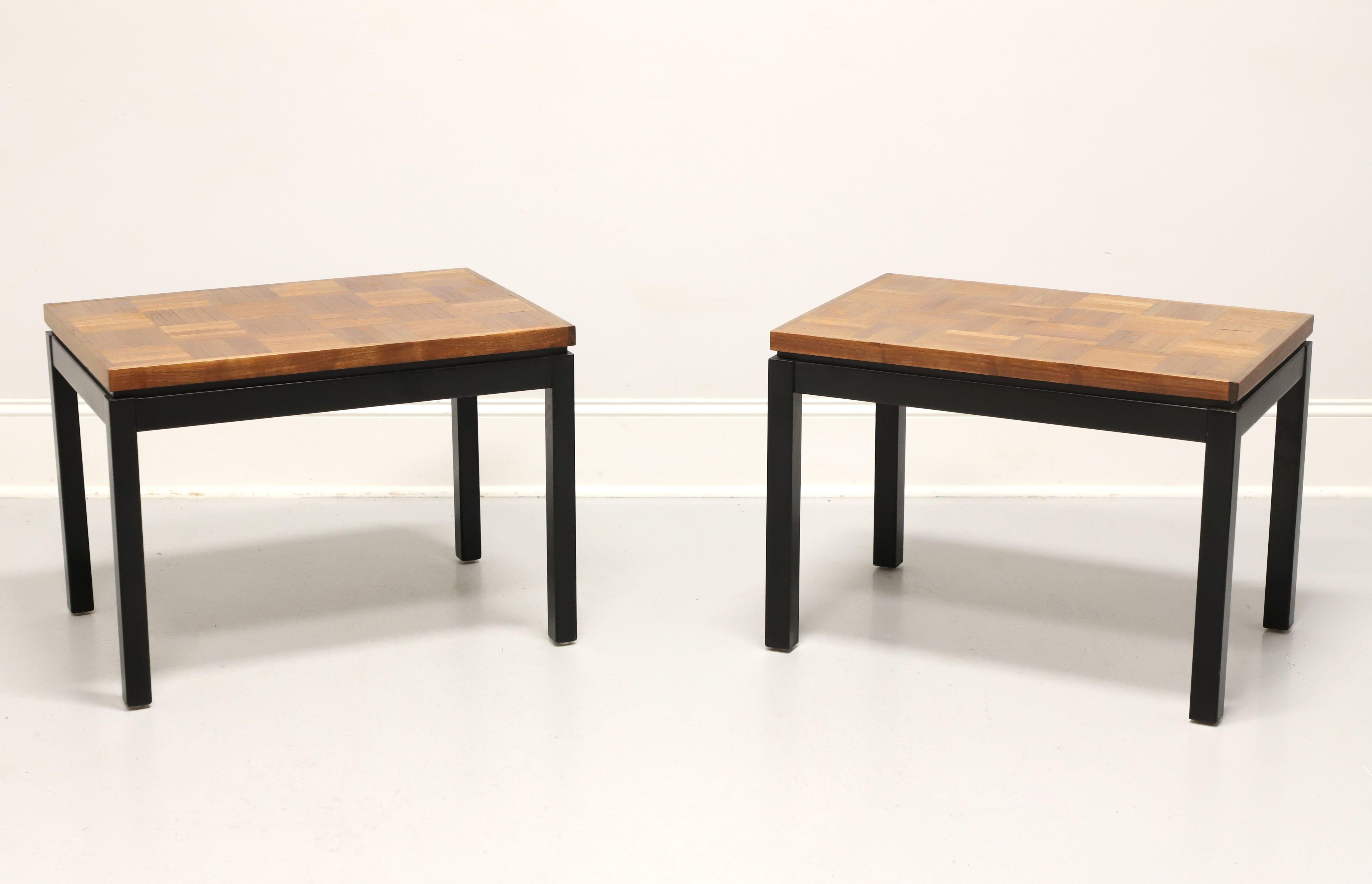 A pair of Modern style side tables, unbranded, similar quality to Drexel Heritage. Pecan, or similar nutwood, parquet design to the squared edge top, black lacquered apron and square straight legs. Likely made in the USA, in the late 20th