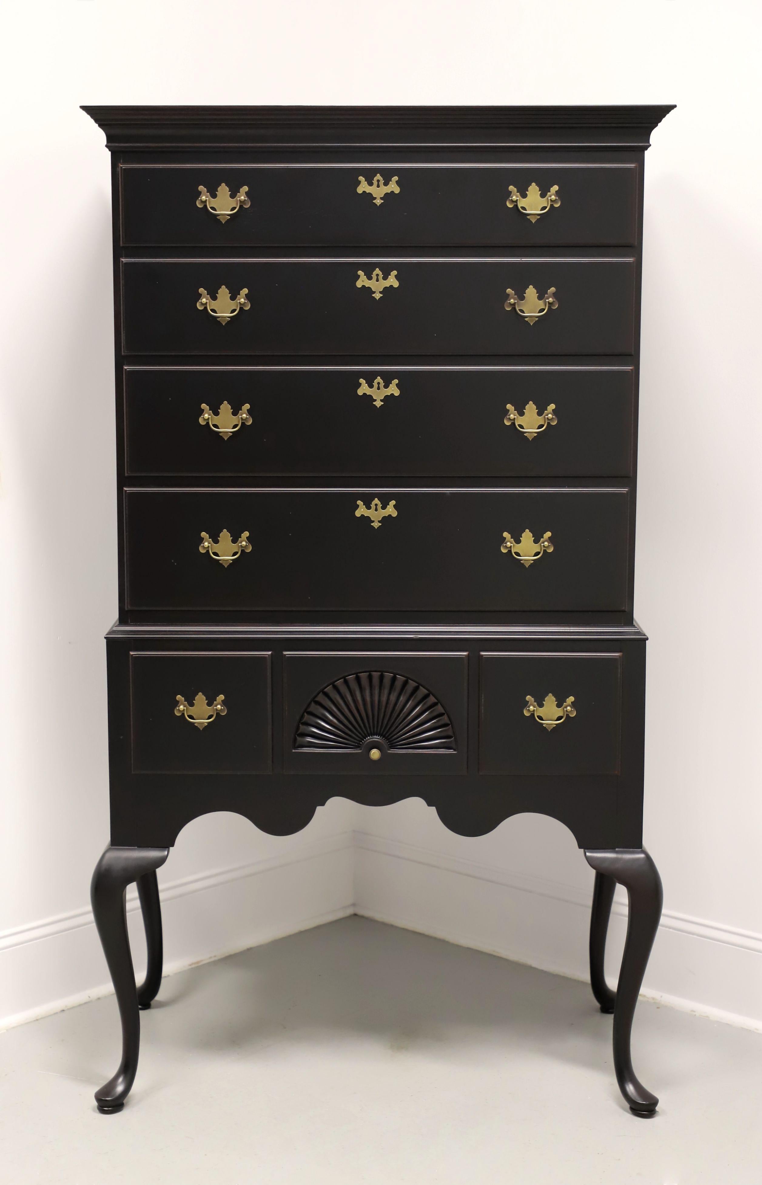 A Queen Anne style highboy chest, unbranded. Black painted hardwood, brass hardware, banded top, crown molding, chest on chest styling, cabriole legs and pad feet. Features seven various size drawers of dovetail construction, four with faux keyhole